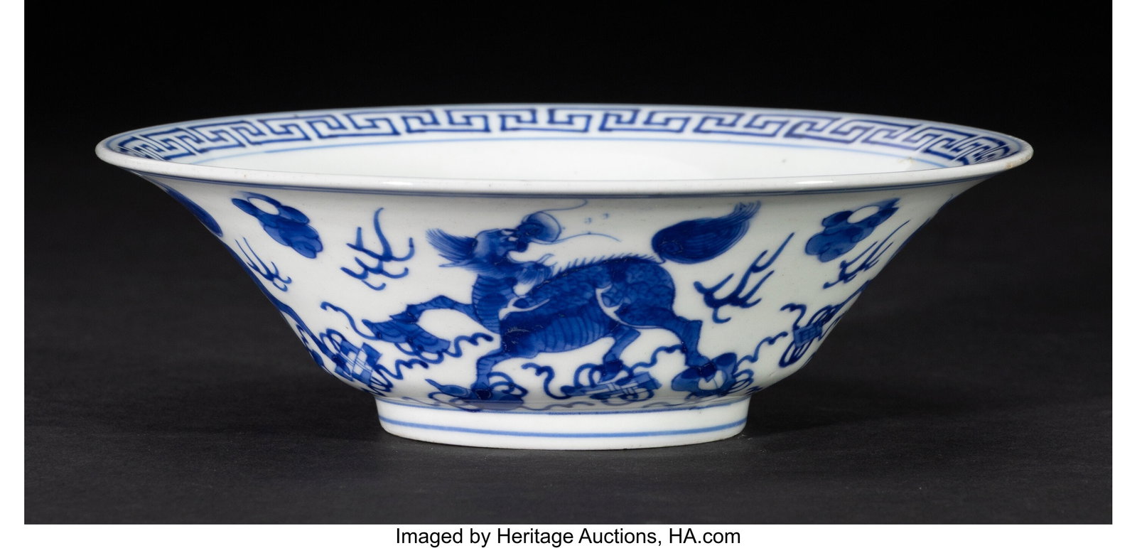 A Chinese Blue and White 'Qilin and Boy' Bowl, K: A Chinese Blue and White 'Qilin and Boy' Bowl, Kangxi period Marks: apocryphal six-character Jiajing mark 2 x 6-1/2 inches (5.1 x 16.5 cm) (diam.&rp