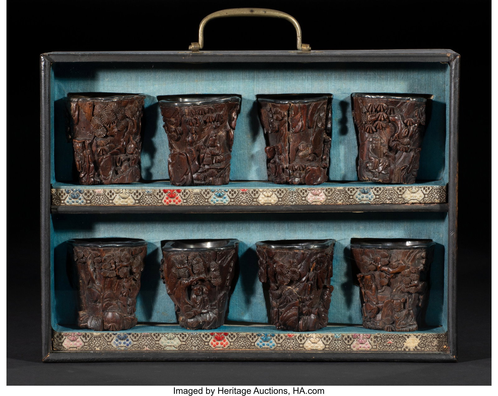 A Group of Eight Chinese Silver-Inlaid and Carve: A Group of Eight Chinese Silver-Inlaid and Carved Agarwood Cups Accompanied by Fitted Case, 19th century Marks: with silver mark to interior 2-3/8 x 2-1/8 x 2-1/4 inches (