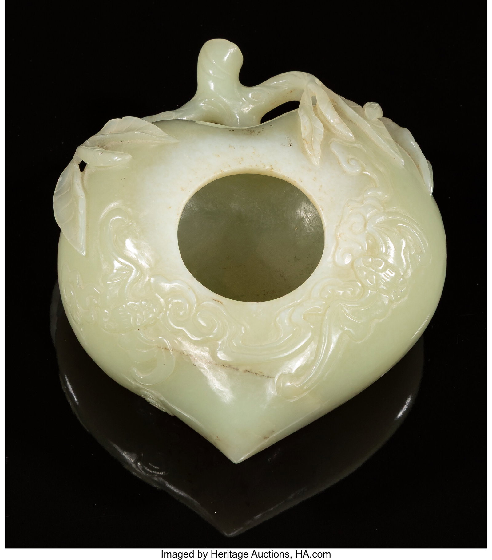 A Chinese Carved Celadon Jade Peach-Form Brush W: A Chinese Carved Celadon Jade Peach-Form Brush Washer, 20th century 2 x 4-1/2 x 5-1/2 inches (5.1 x 11.4 x 14.0 cm) the washer carved vividly in the form o