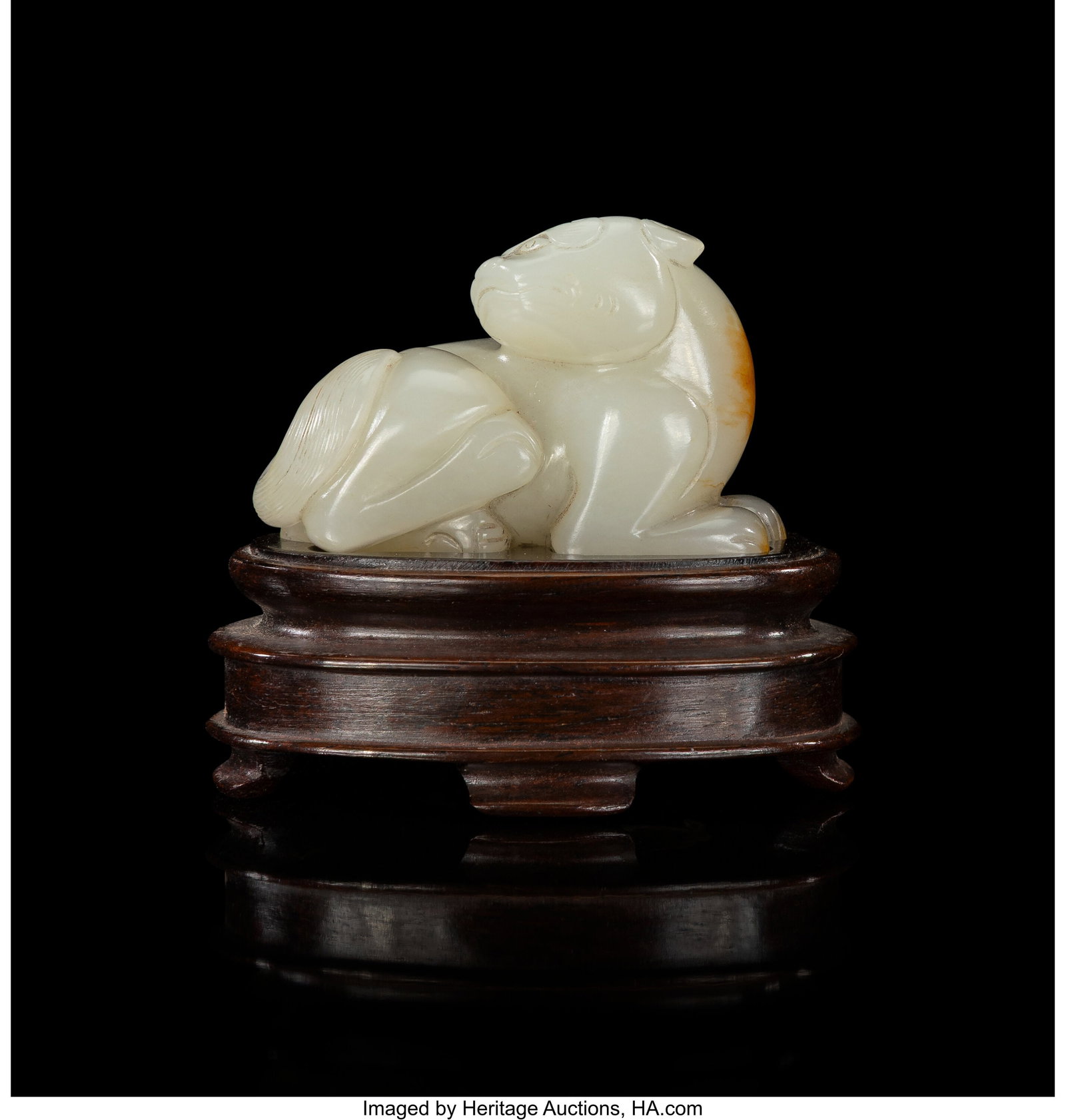 A Chinese Carved Russet Pale Celadon Jade Figure: A Chinese Carved Russet Pale Celadon Jade Figure of a Recumbent Animal, 18th century 1-1/4 x 1-7/8 x 1 inches (3.2 x 4.8 x 2.5 cm) (work) 2-1&sol
