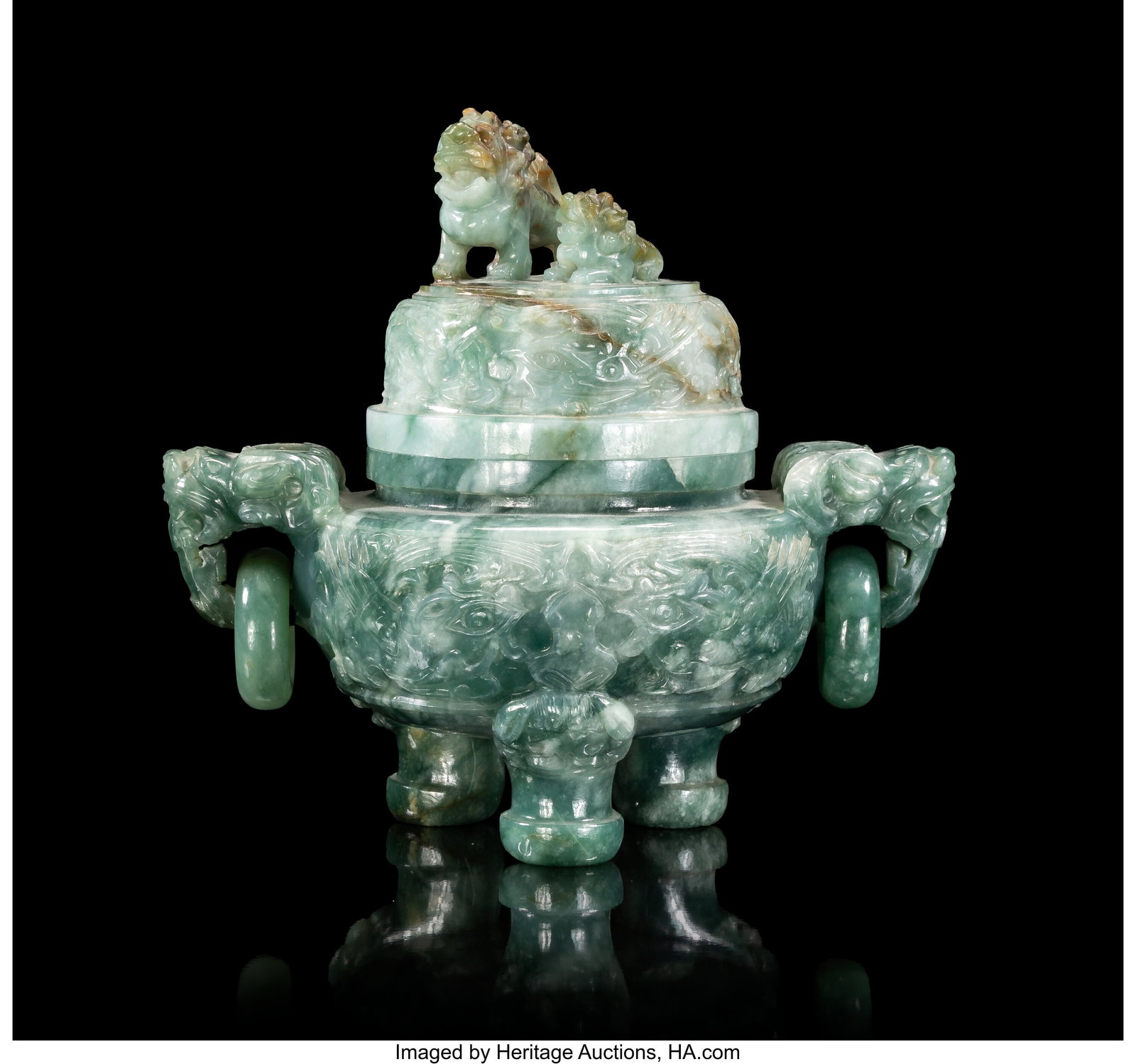 A Chinese Carved Jadeite Tripod Double-Handled C: A Chinese Carved Jadeite Tripod Double-Handled Censer with Cover, 20th century 5-3/8 x 5-1/2 x 3-7/8 inches (13.7 x 14.0 x 9.8 cm) the body of compress