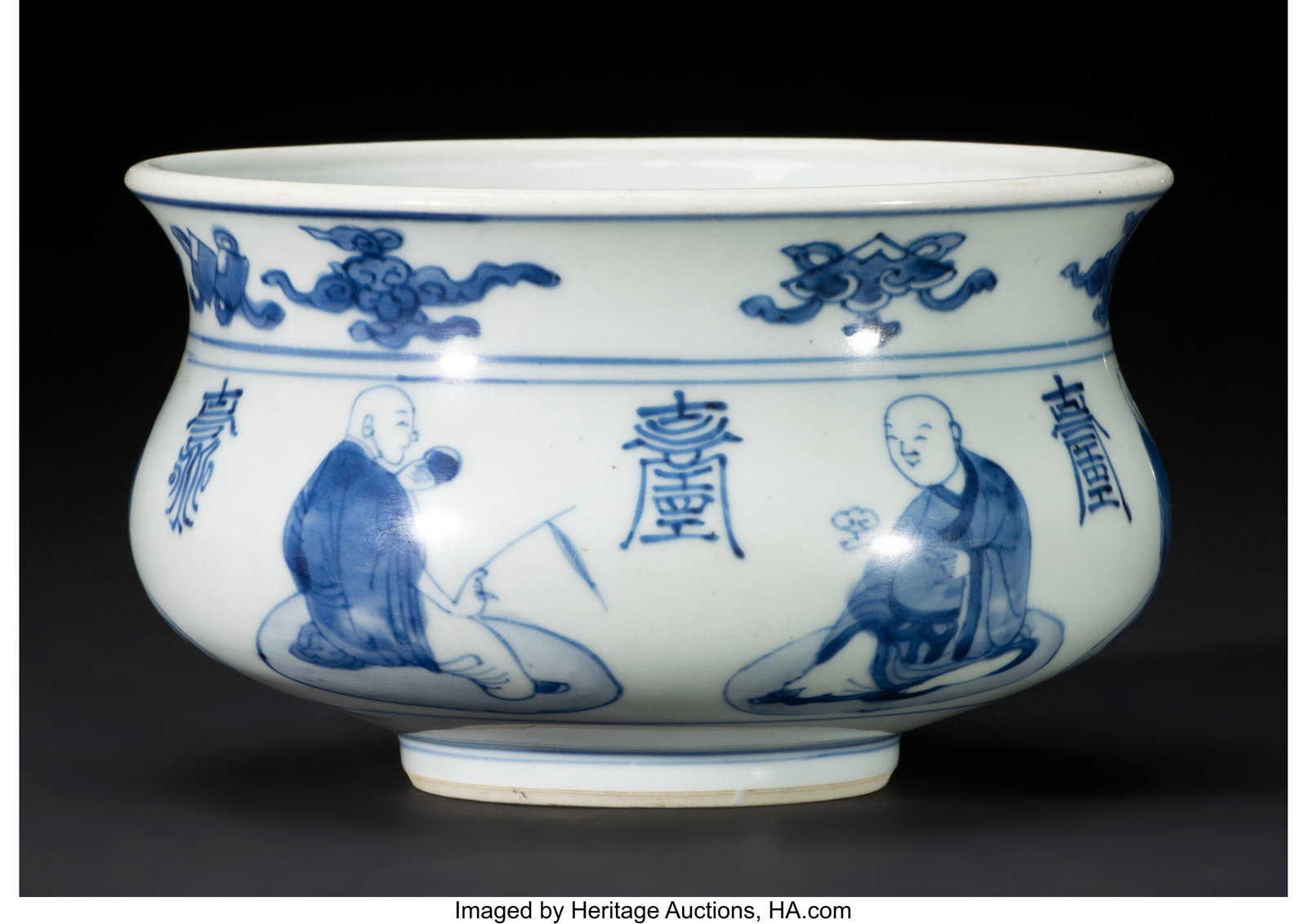 A Chinese Blue and White Buddhist Emblem Bowl wi: A Chinese Blue and White Buddhist Emblem Bowl with Six Monks, Kangxi period 4-1/8 x 6-3/4 inches (10.5 x 17.1 cm) (diam.) HID03101062020 © 2