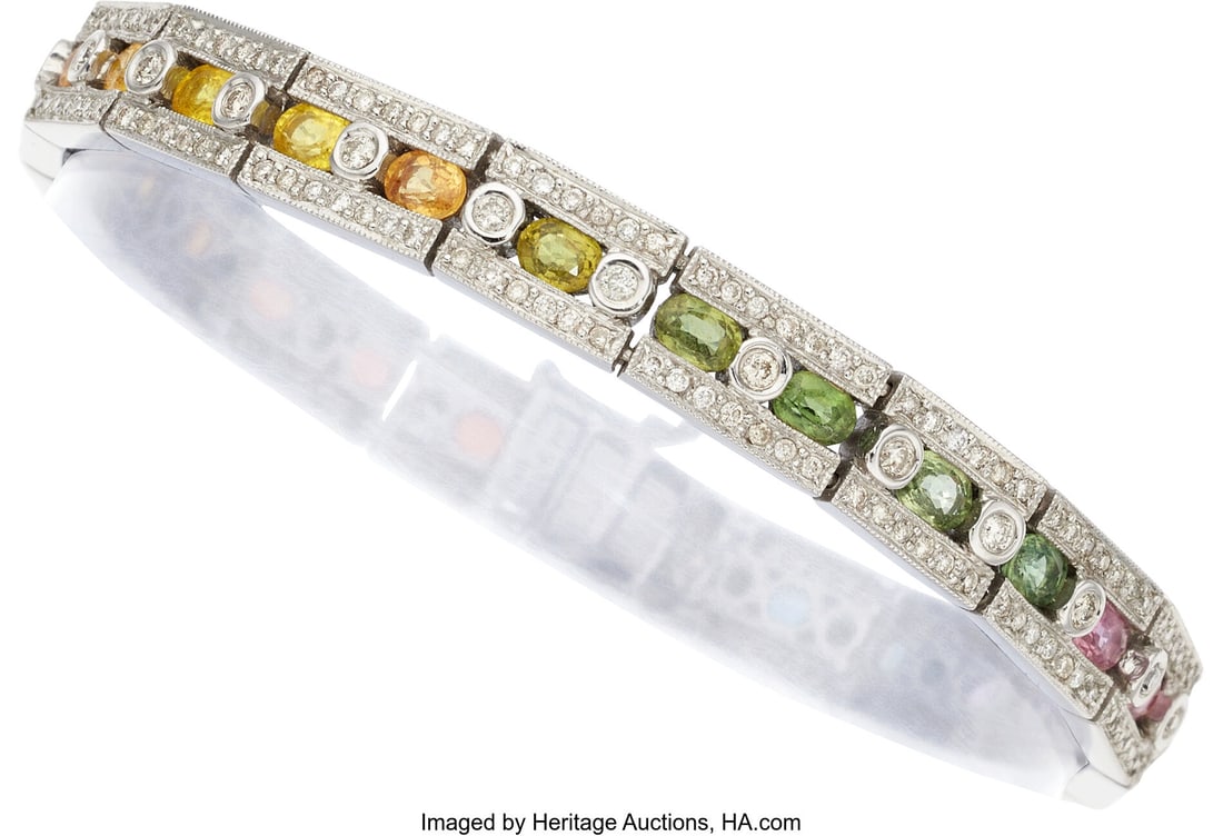 Multi-Color Sapphire, Diamond, Gold Bracelet St: Multi-Color Sapphire, Diamond, Gold Bracelet Stones: Oval-shaped multi-color sapphires weighing a total of 6.76 carats; full-cut diamonds weighing a total of 1.85 