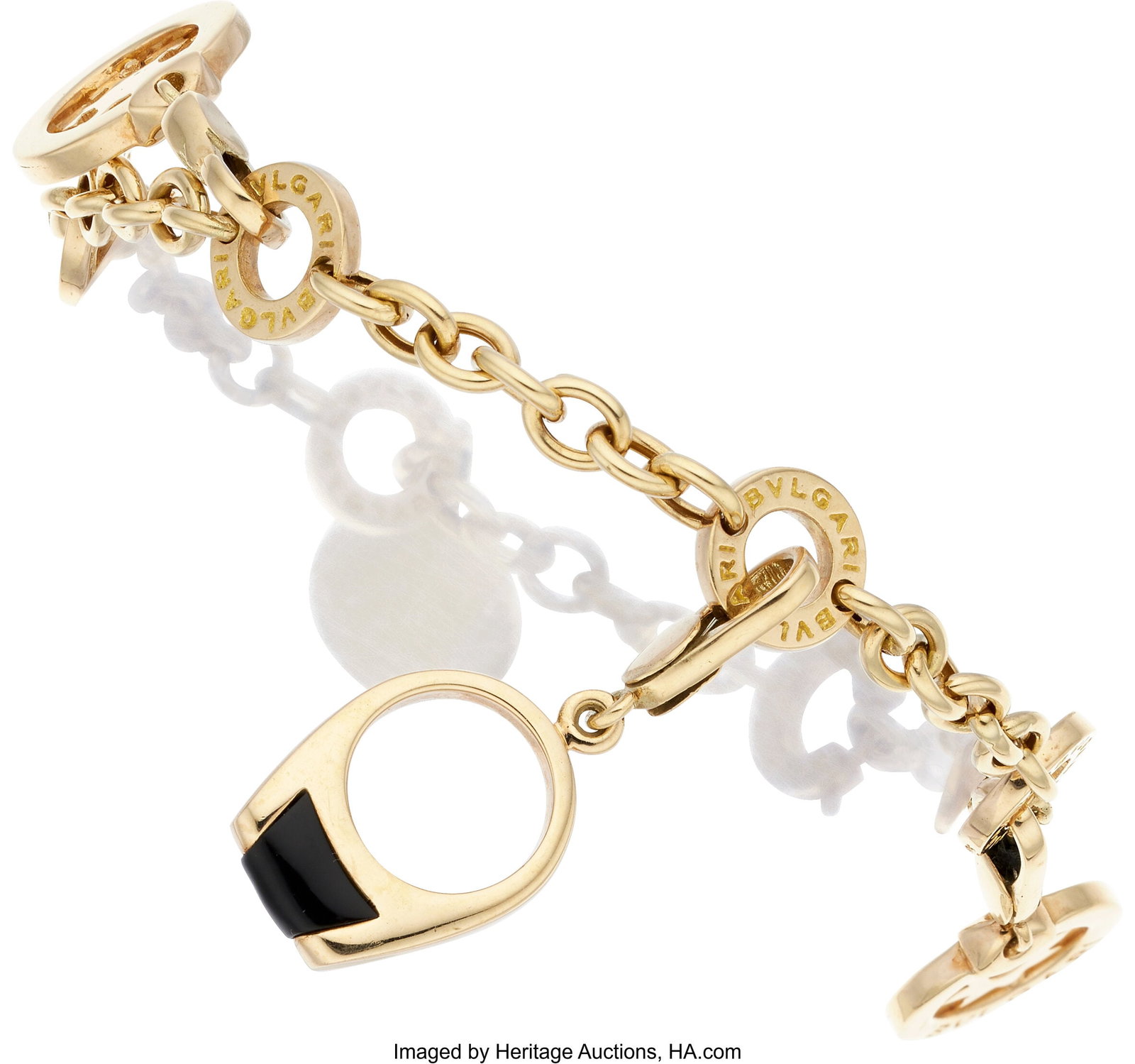 Black Onyx, Citrine, Gold, Yellow Metal Bracelet: Black Onyx, Citrine, Gold, Yellow Metal Bracelet Stones: Citrine briolette; carved black onyx; black onyx bead Metal: 18k and 14k gold, and yellow metal G