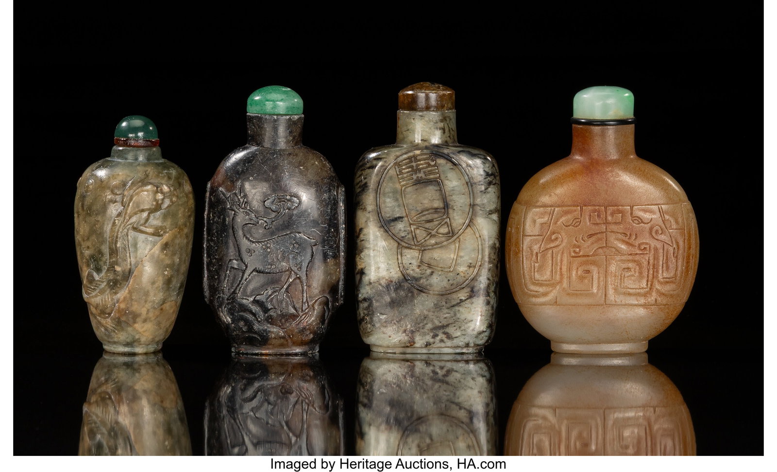 A Group of Four Chinese Carved Jade Snuff Bottle: A Group of Four Chinese Carved Jade Snuff Bottles 3 x 1-5/8 x 0-1/2 inches (7.6 x 4.1 x 1.3 cm) (tallest) HID03101062020 © 2026 Heritage Auctions 