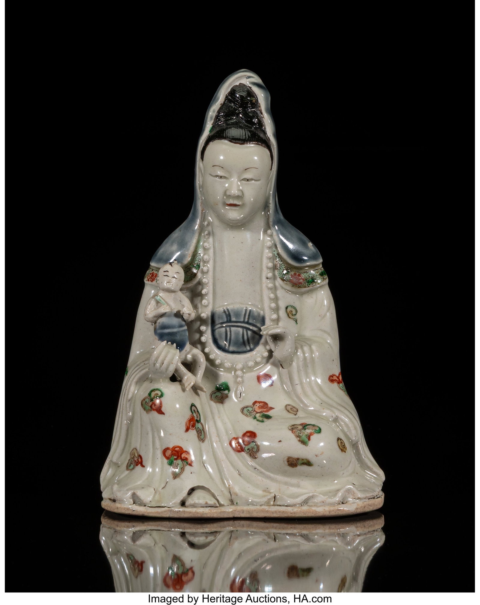 A Chinese Ceramic Figure of Guanyin Carrying Chi (1 of 4)