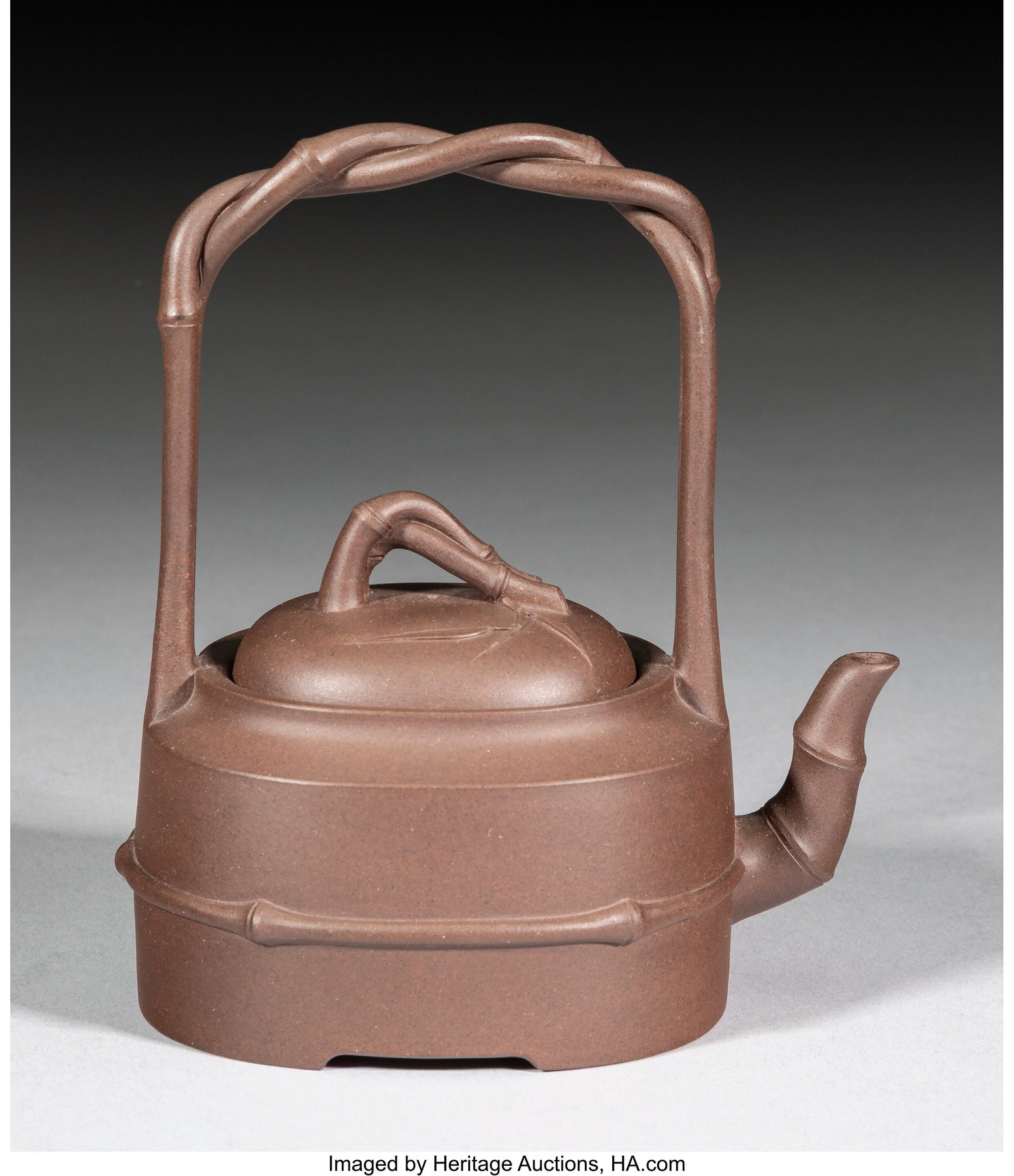 A Chinese Yixing Teapot by Liu Jianjun, 20th cen: A Chinese Yixing Teapot by Liu Jianjun, 20th century Marks: four-character mark 5 x 4-1/8 x 3 inches (12.7 x 10.5 x 7.6 cm) HID03101062020 © 2026 He