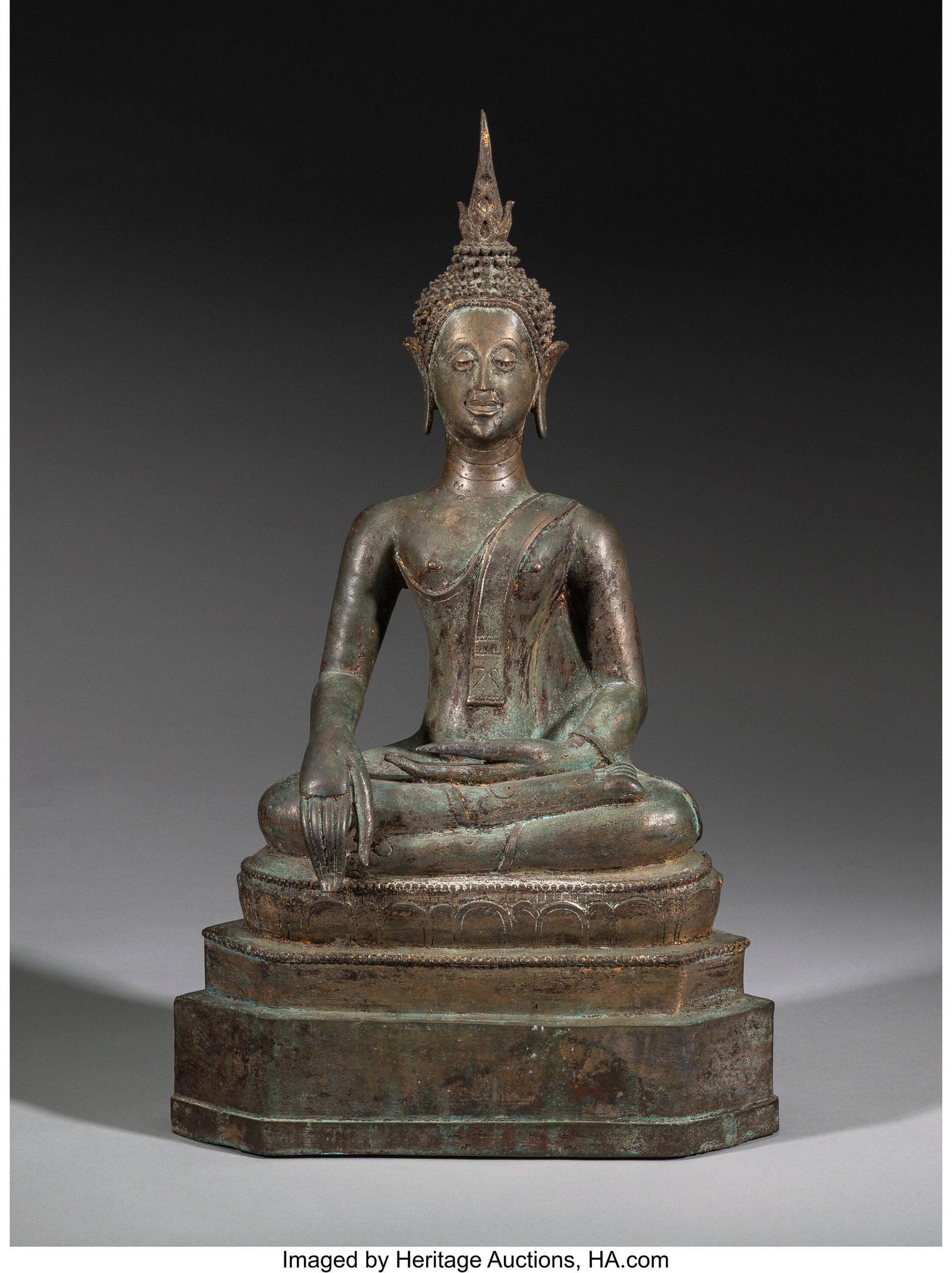 A Thai Gilt Bronze Figure of a Seated Buddha and (1 of 4)