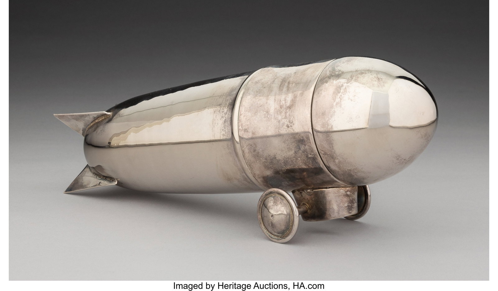 A Zeppelin Cocktail Shaker, late 20th century 4-: A Zeppelin Cocktail Shaker, late 20th century 4-3/4 x 13 x 3-1/2 inches (12.1 x 33.0 x 8.9 cm) HID03101062020 © 2026 Heritage Auctions | All Righ