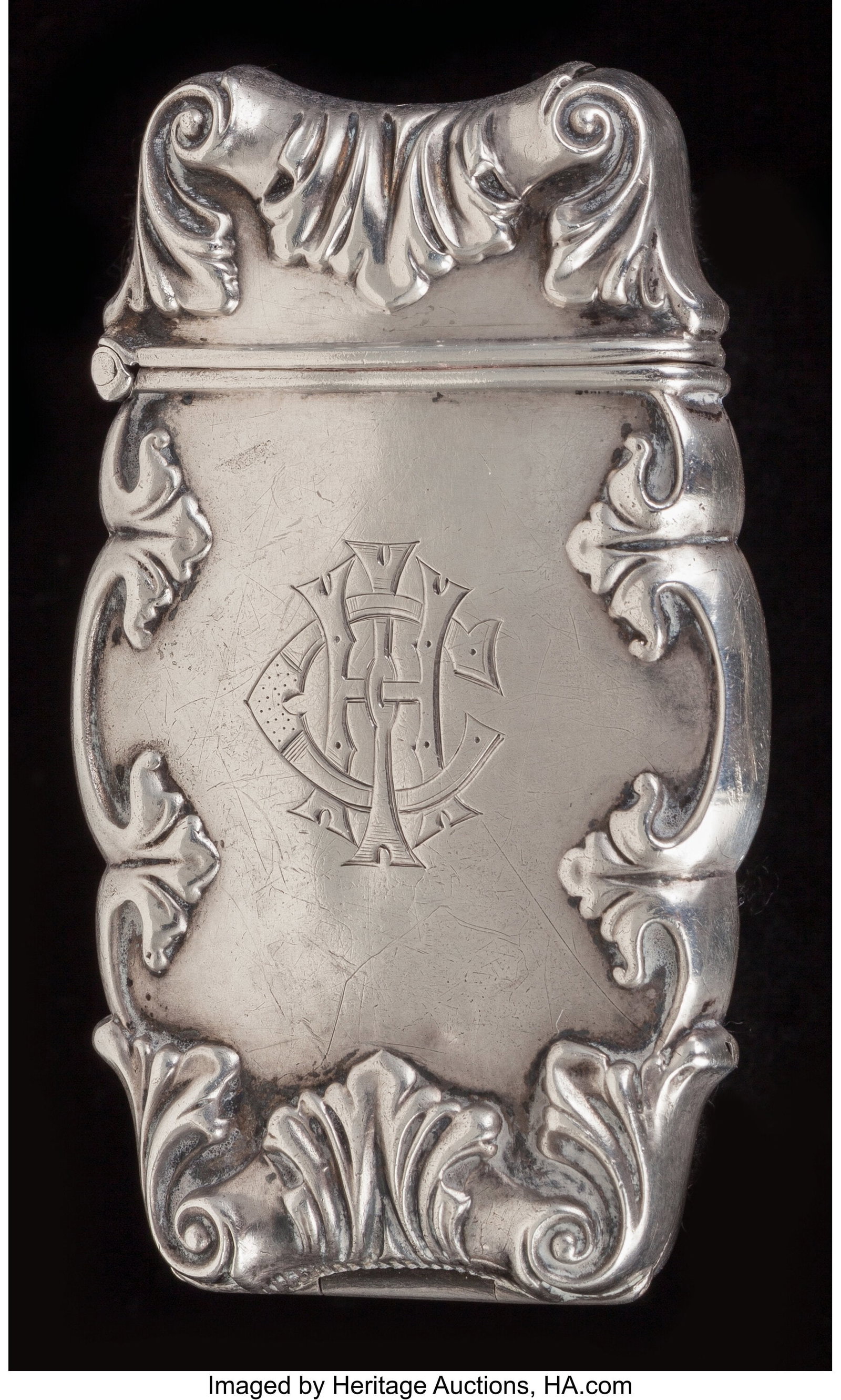 An American Silver Match Safe, circa 1900 2-5/8 : An American Silver Match Safe, circa 1900 2-5/8 inches (6.7 cm) 31.10 grams (1 troy ounces) Monogram: CHI The shaped match safe with scrolling repouss
