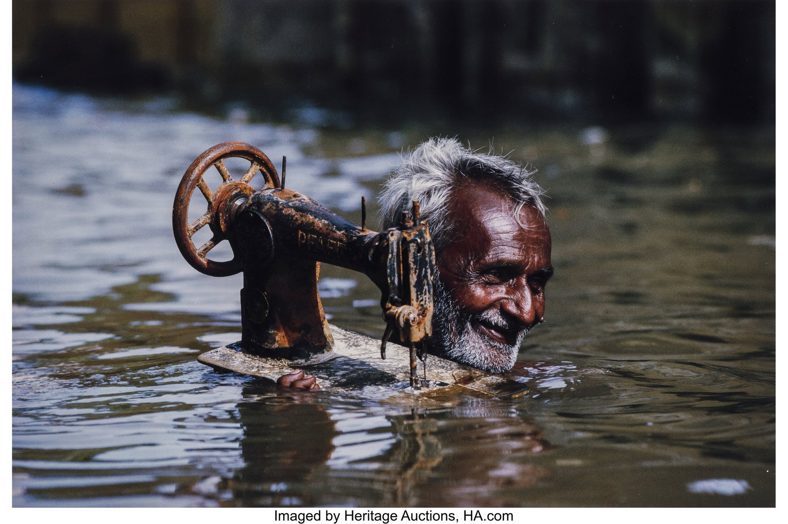 Steve McCurry (American, b. 1950) Tailor Carryin: Steve McCurry (American, b. 1950) Tailor Carrying His Sewing Machine, Porbandar, India, 1983 Dye bleach print, printed 2005 15-1/4 x 22-3/8 inche