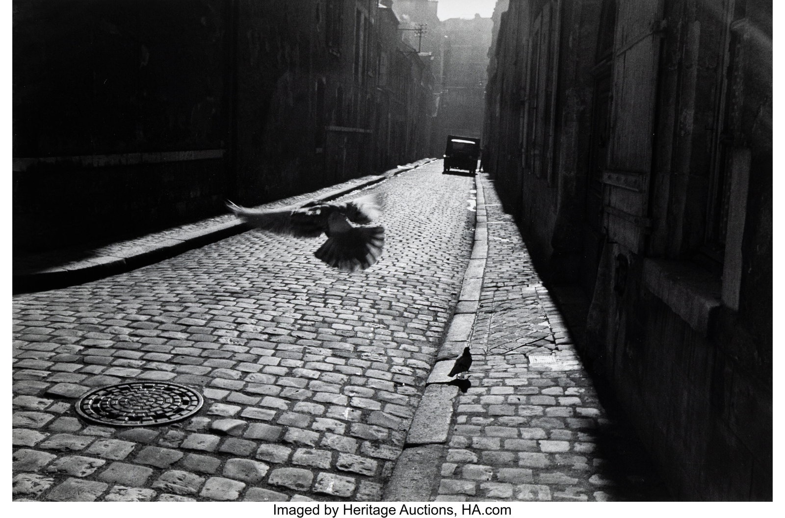 Elliott Erwitt (American, 1928-2023) Orleans, Fr: Elliott Erwitt (American, 1928-2023) Orleans, France, 1952 Gelatin silver print, printed 1974 8-7/8 x 13-3/8 inches (22.5 x 34.0 cm) &