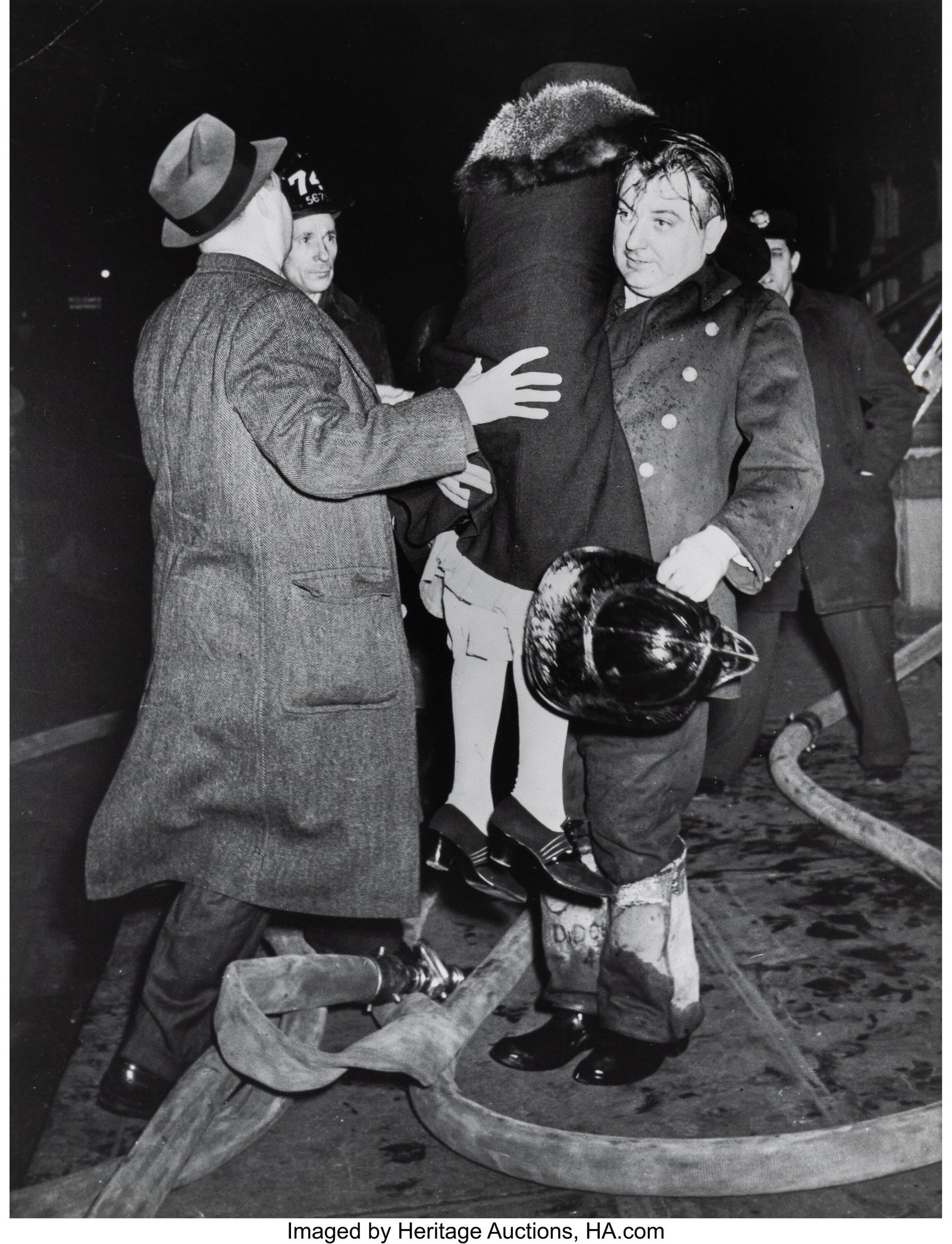 Weegee (American, 1899-1968) Fireman's Lift, 194 (1 of 3)