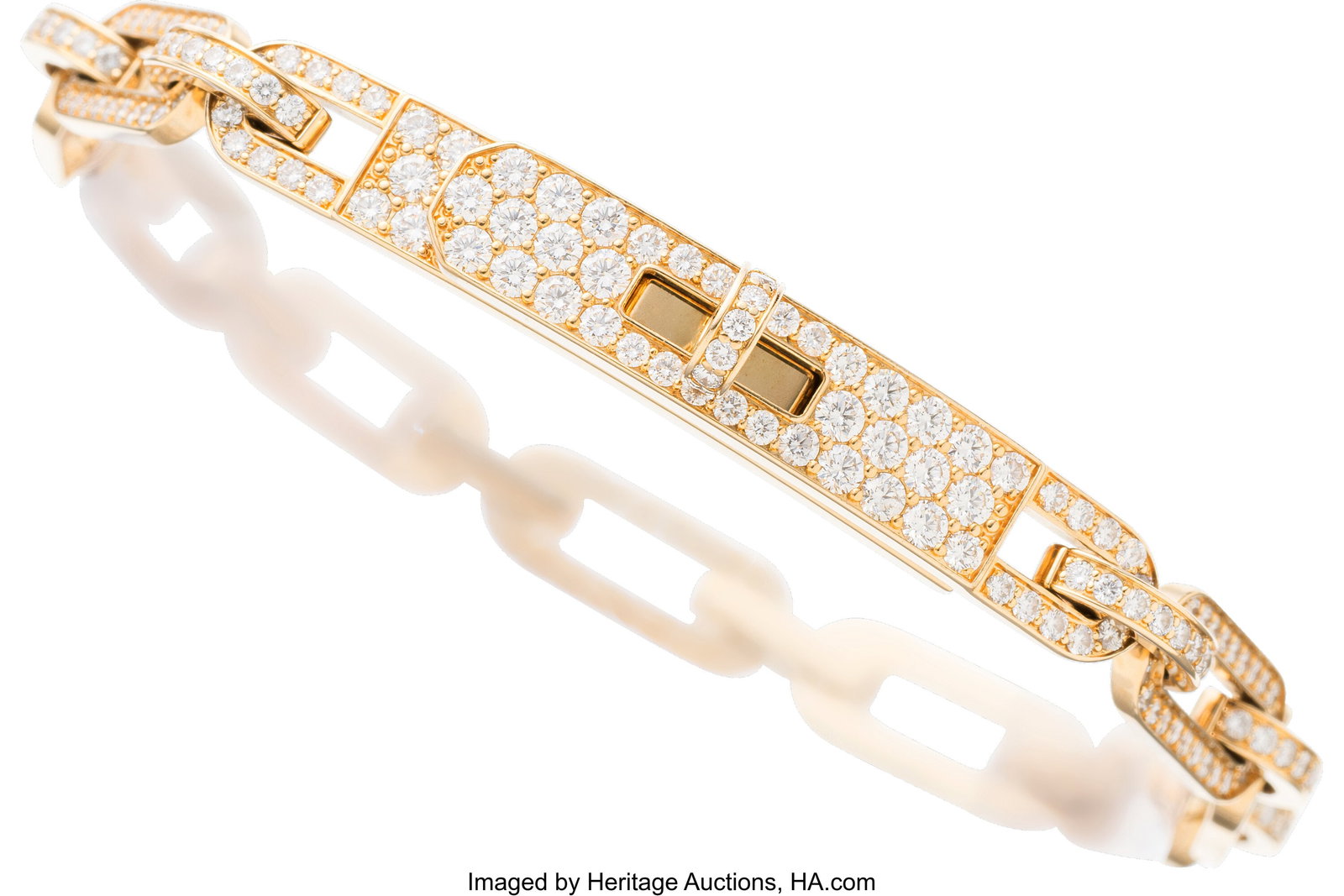 Hermès 18K Gold Full Pave Diamond Kelly Chaine : Hermès 18K Gold Full Pave Diamond Kelly Chaine Bracelet Condition: 2 Designer Size ST This bracelet is done in 18K Rose Gold, featuring pave-set diamonds and a Kelly turnlock motif&
