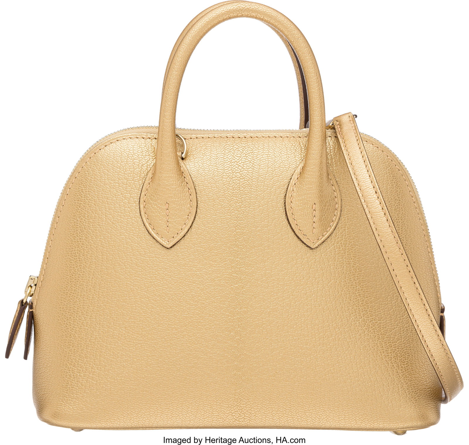 Hermès Metallic Doré Chevre Chamkilight Leathe: Hermès Metallic Doré Chevre Chamkilight Leather Mini Bolide 1923 Bag with Gold Hardware G, 2026 Condition: 1 7" Width x 5.5" Height x 3" Depth This bag is done in Dor&