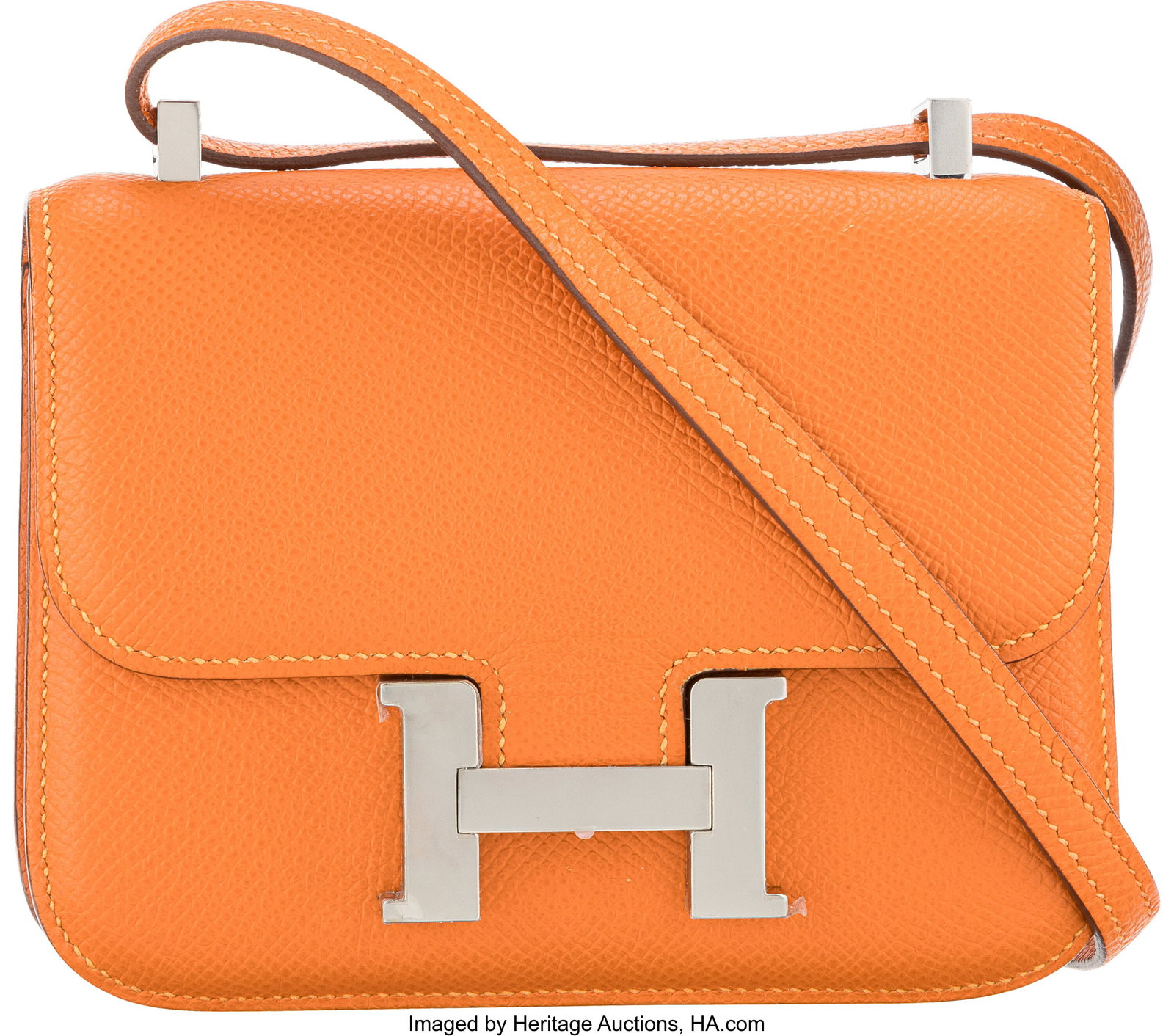 Hermès 14cm Orange Epsom Leather Micro Constanc: Hermès 14cm Orange Epsom Leather Micro Constance with Palladium Hardware N Square, 2010 Condition: 2 5.5" Width x 4.25" Height x 1" Depth This bag is done in Orange