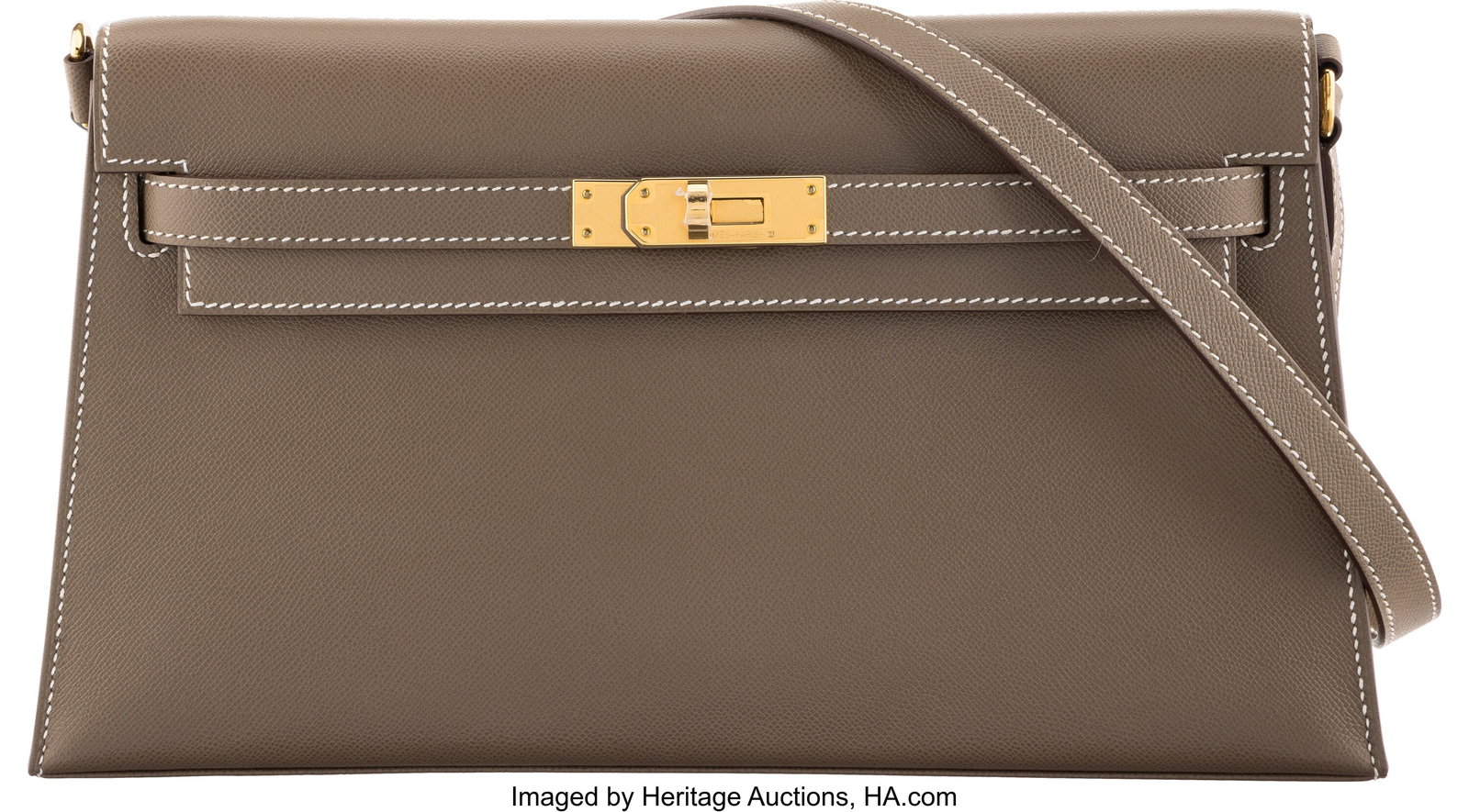 Hermès Etoupe Madame Leather Kelly Elan with Go: Hermès Etoupe Madame Leather Kelly Elan with Gold Hardware W, 2024 Condition: 2 11" Width x 6" Height x 1.5" Depth This bag is done in Etoupe Madame Leather with Gold Hardwar