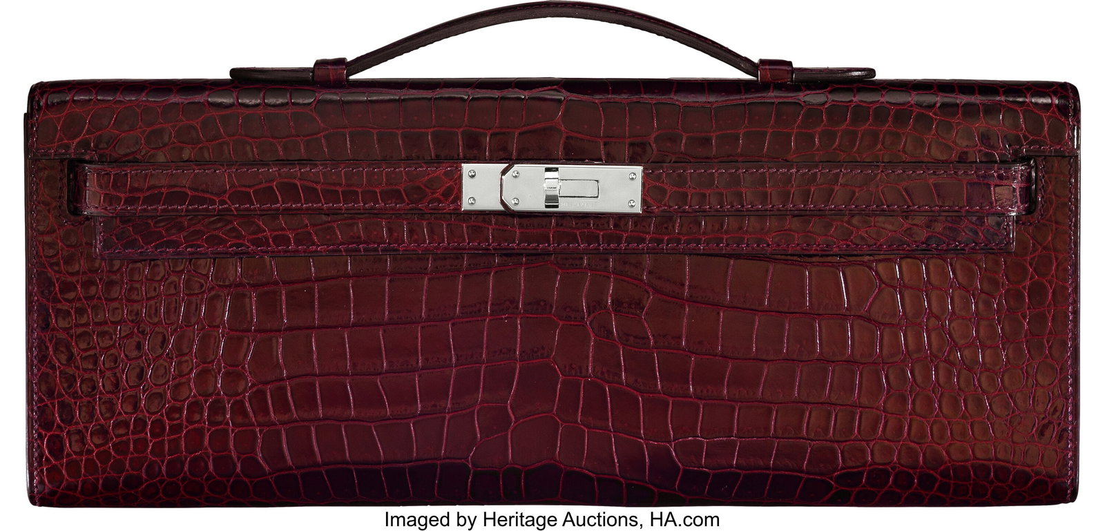 Hermès Shiny Bourgogne Porosus Crocodile Kelly : Hermès Shiny Bourgogne Porosus Crocodile Kelly Cut Clutch with Palladium Hardware T, 2015 Condition: 2 12.25" Width x 5" Height x 1" Depth This bag is done in Shiny Bourgogne