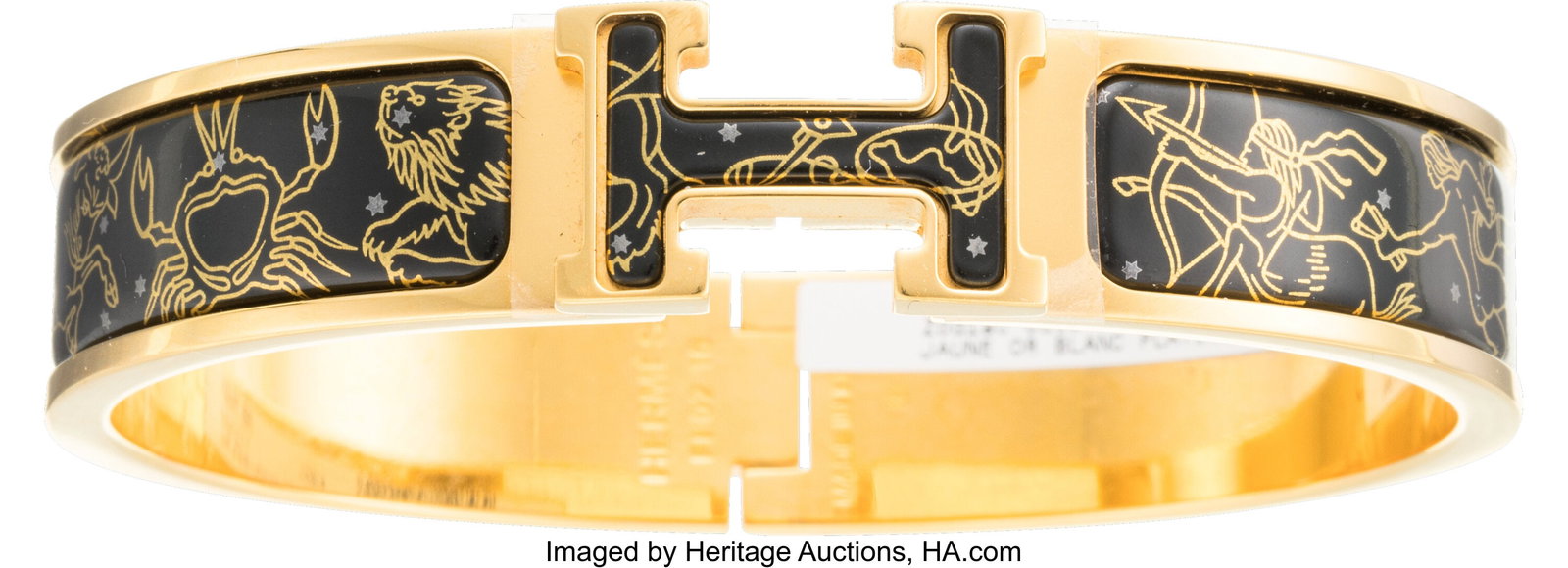 Hermès Gold & Black Enamel Zodiaque Clic H Brac: Hermès Gold & Black Enamel Zodiaque Clic H Bracelet Condition: 2 6.75" Circumference This bracelet is Gold Plated, featuring Zodiaque printed enamel designed by Wlodek Ka