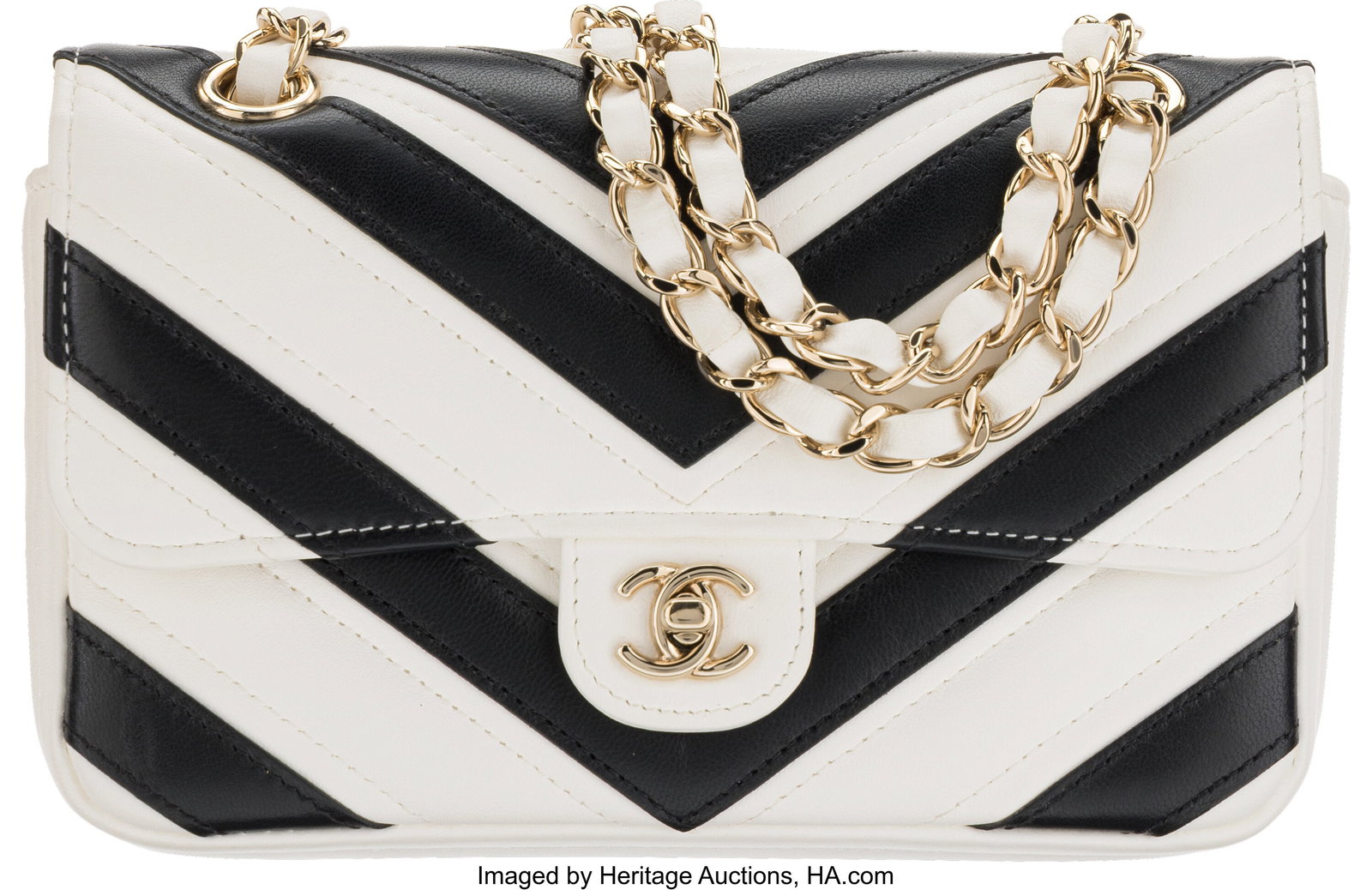 Chanel Black & White Chevron Quilted Lambskin Le: Chanel Black & White Chevron Quilted Lambskin Leather Mini Rectangular Flap Bag with Light Gold Hardware Condition: 2 7.25" Width x 4" Height x 2" Depth This bag is done in Black and 