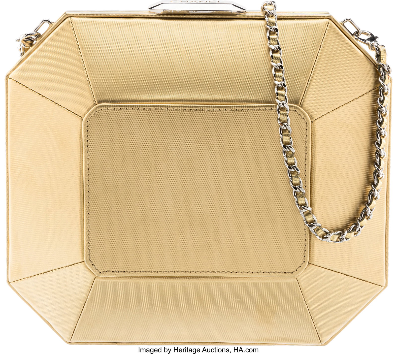 Chanel Gold Leather Octagon Minaudière with Sil: Chanel Gold Leather Octagon Minaudière with Silver Hardware Condition: 3 10" Width x 9" Height x 3" Depth This bag is done in Gold Leather with Silver Hardware, featuring a removeab