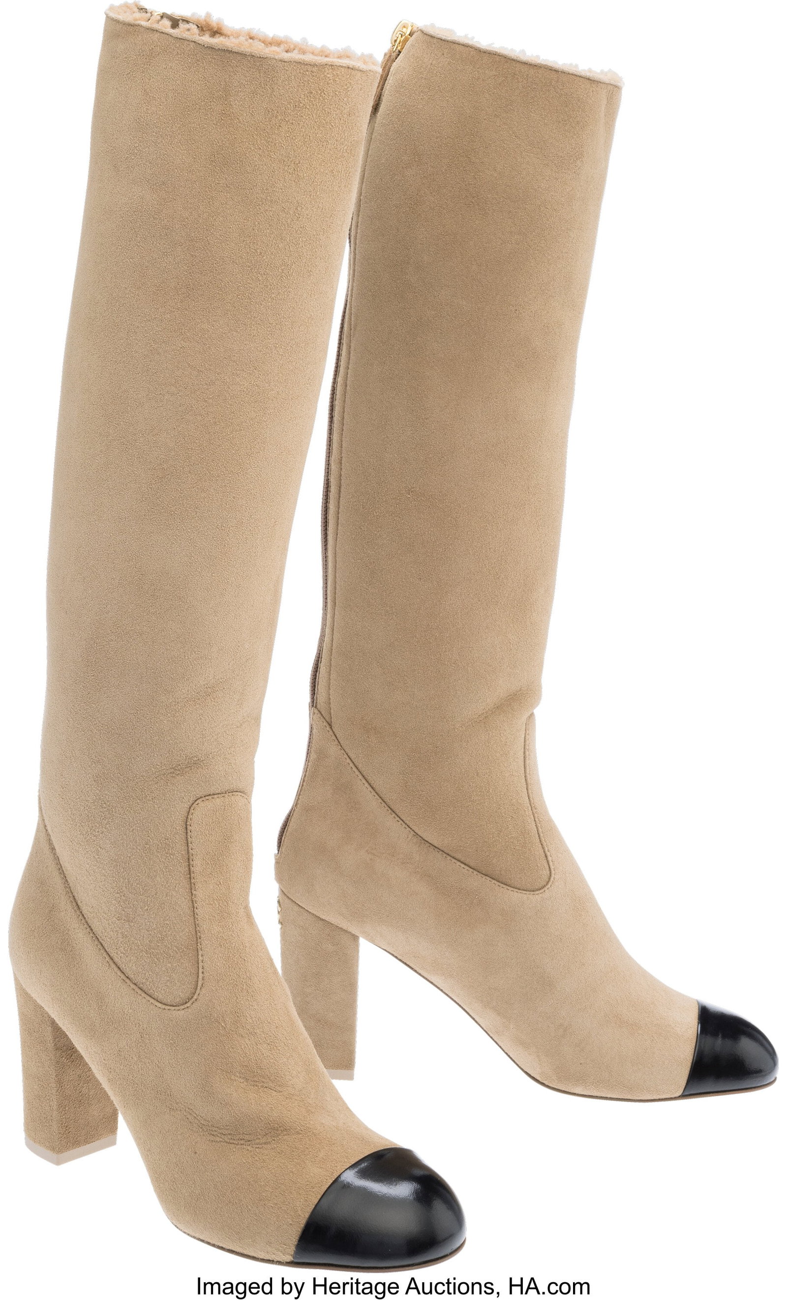 Chanel Beige Suede Shearling Block Heel Boots Co: Chanel Beige Suede Shearling Block Heel Boots Condition: 1 Size: 38.5 These boots are done in Beige Suede Shearling with a Black Leather cap toe and a block heel, featuring a 