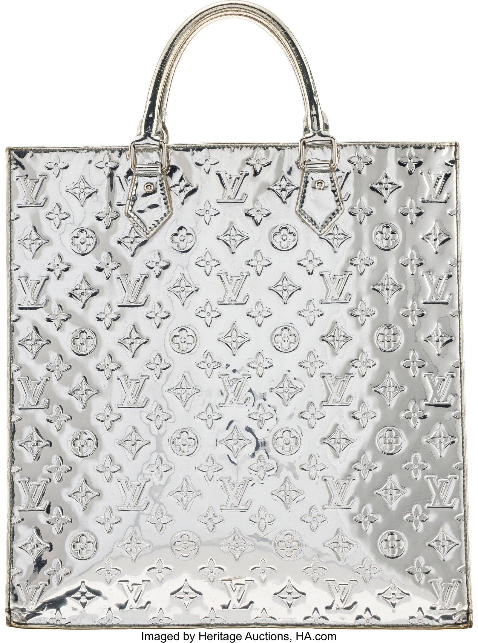 Louis Vuitton Metallic Silver Monogram Vernis Le: Louis Vuitton Metallic Silver Monogram Vernis Leather Miroir Sac Plat Tote Bag Condition: 4 14" Width x 15" Height x 3.5" Depth This bag is done in silver mirrored monogram embossed verni
