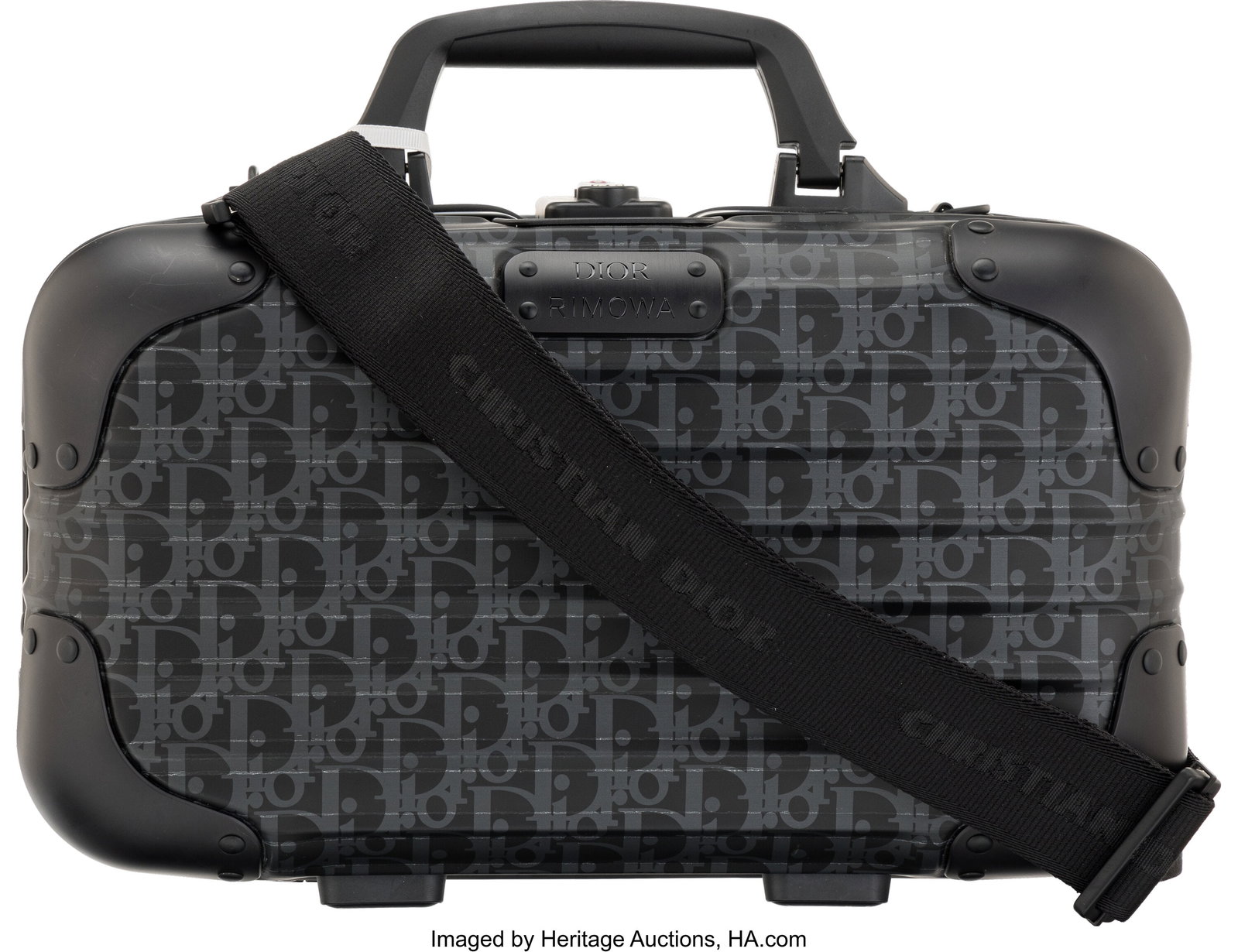 Christian Dior x Rimowa Black Oblique Aluminum C: Christian Dior x Rimowa Black Oblique Aluminum Carry-On Hard Case Condition: 2 14" Width x 8" Height x 5" Depth This bag is done in Black Oblique Aluminum with Black Hardware, featuring