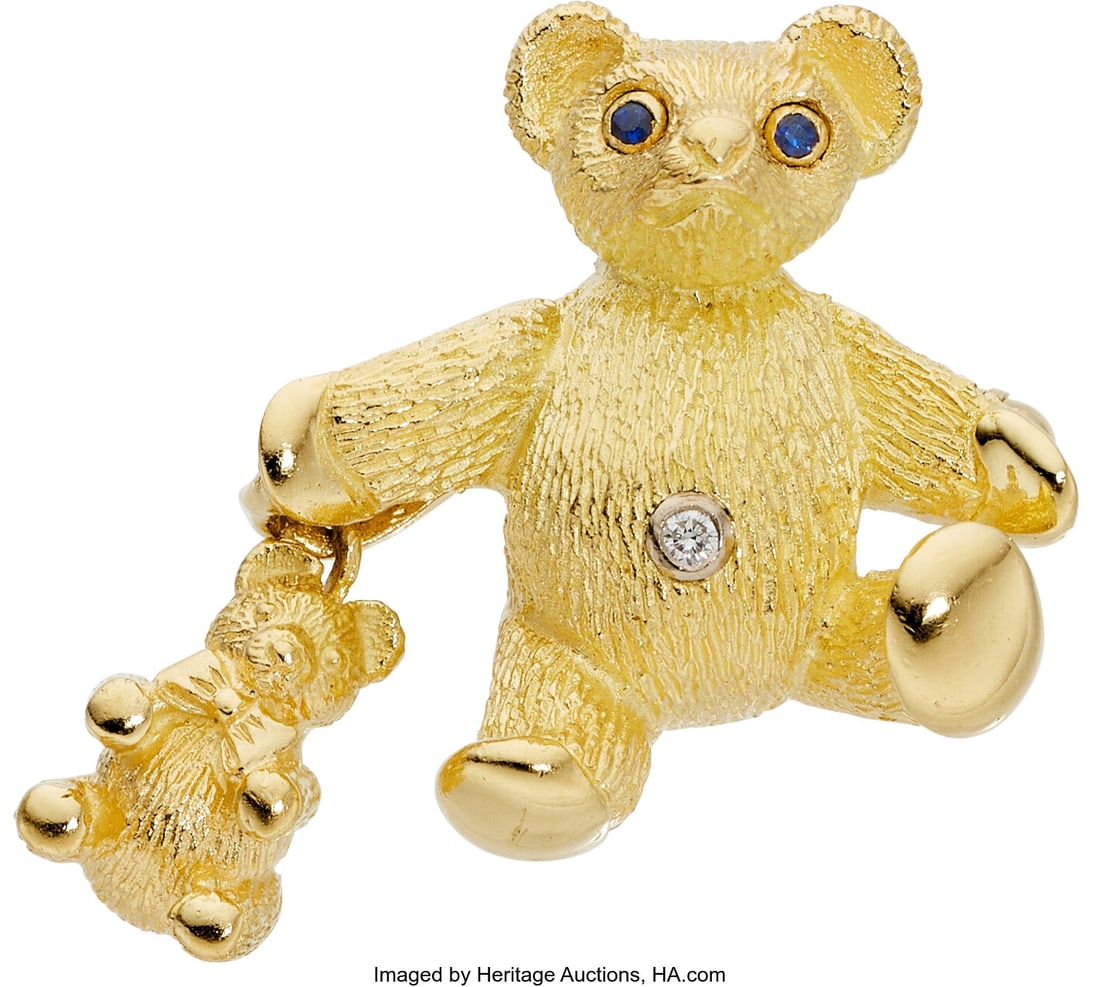 Tiffany & Co. Diamond, Sapphire Gold Pendant-Bro: Tiffany & Co. Diamond, Sapphire Gold Pendant-Brooch, circa 1991 Stones: Round-shaped sapphire; full-cut diamond Metal: 18k gold Marked: Tiffany & Co&p