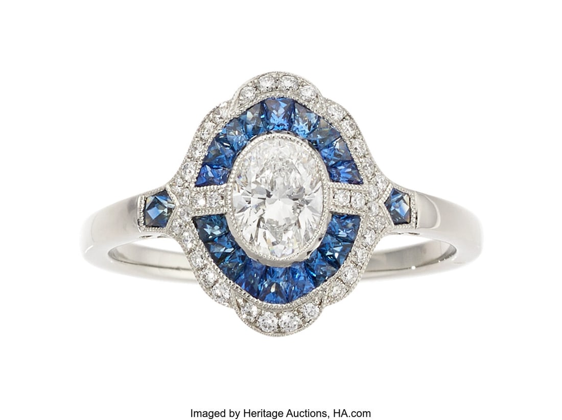 Sabrina Diamond, Sapphire, Platinum Ring Stones: Sabrina Diamond, Sapphire, Platinum Ring Stones: Oval-shaped diamond weighing 0.50 carat; full-cut diamonds weighing a total of approximately 0.20 carat; Fren