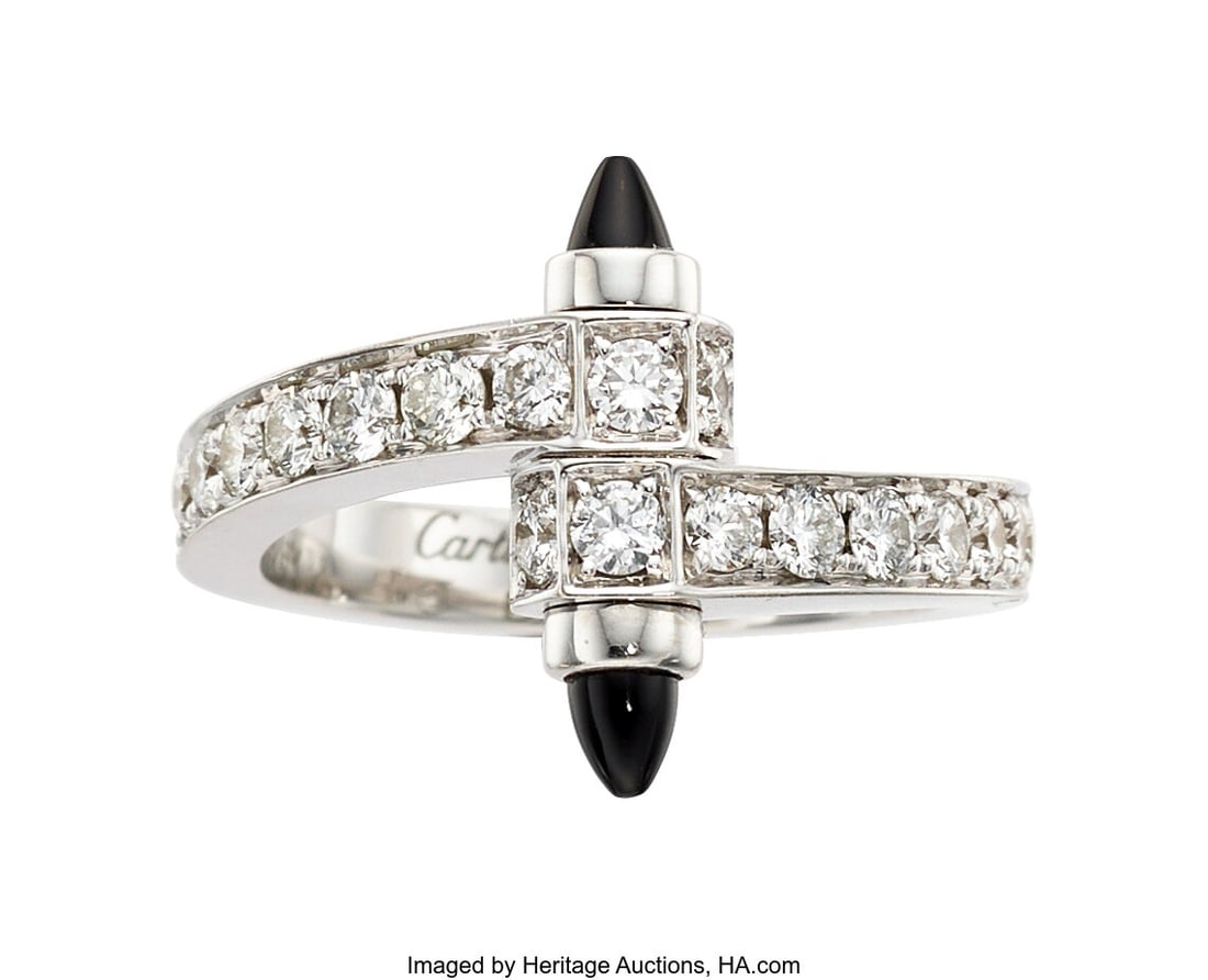 Cartier Diamond, Black Onyx, White Gold Ring St: Cartier Diamond, Black Onyx, White Gold Ring Stones: Full-cut diamonds weighing a total of approximately 1.00 carat; carved black onyx Metal: 18k white gold Marked&