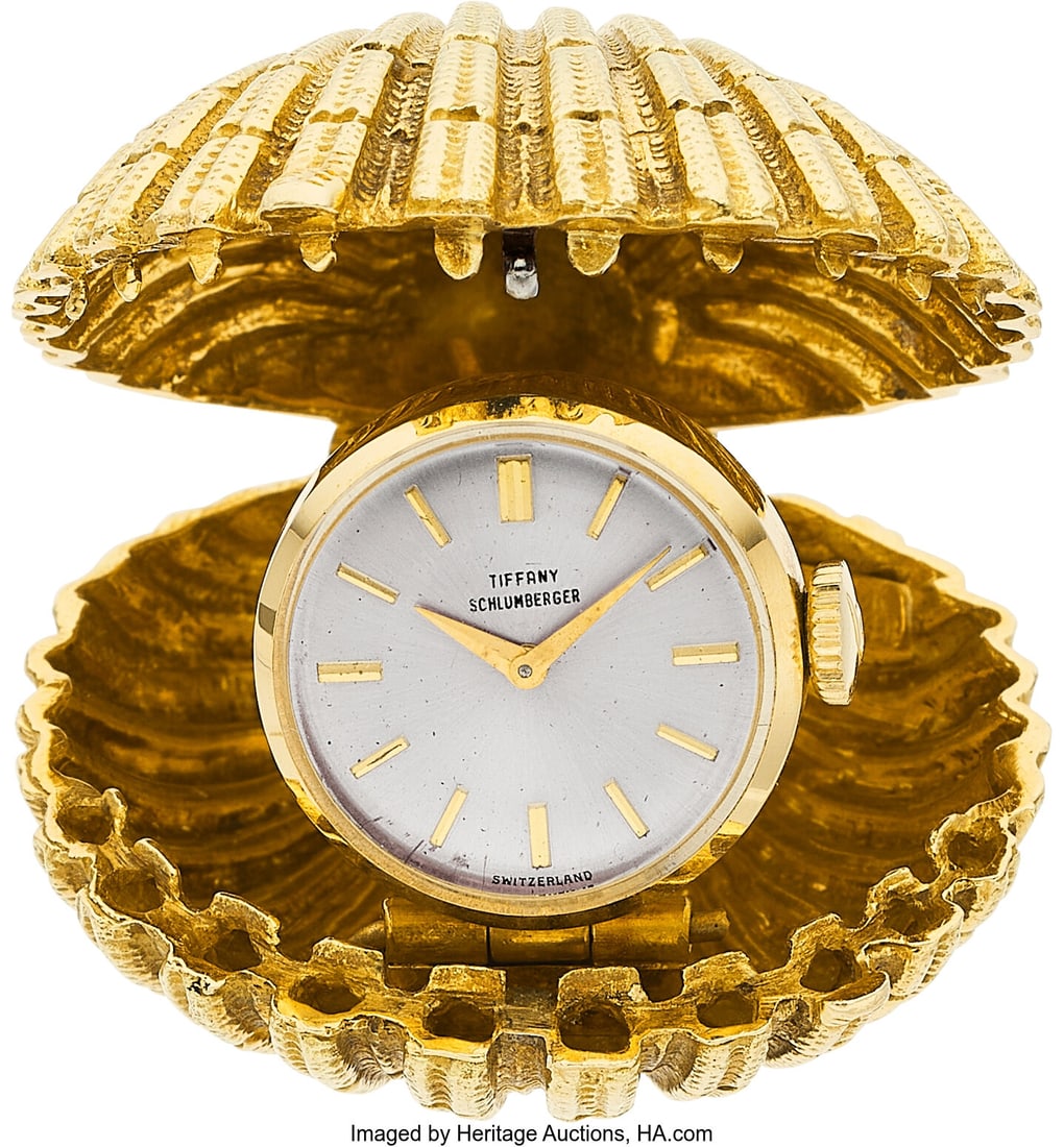 Schlumberger for Tiffany & Co. Gold Clock, circa: Schlumberger for Tiffany & Co. Gold Clock, circa 1960s Case: 35 x 33 mm, shell, 18k gold Dial: Silvered, gold-tone stick hour markers, gold-tone Da