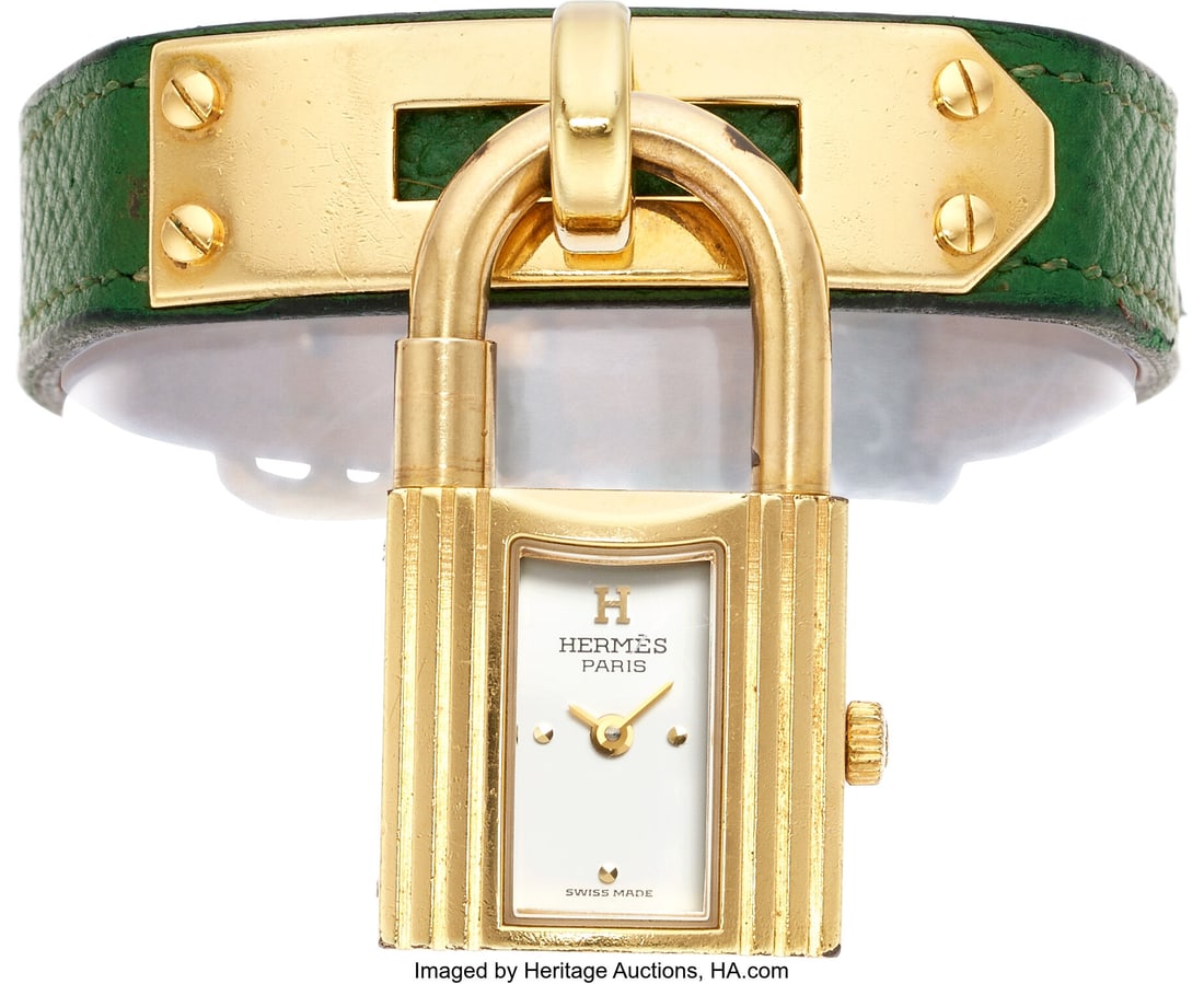 Hermès Gold Finish "Kelly" Watch Case: 20 x 20: Hermès Gold Finish "Kelly" Watch Case: 20 x 20 mm, square, yellow metal, back secured by 4 screws, mineral crystal Dial: White, gold-tone dot hour mark