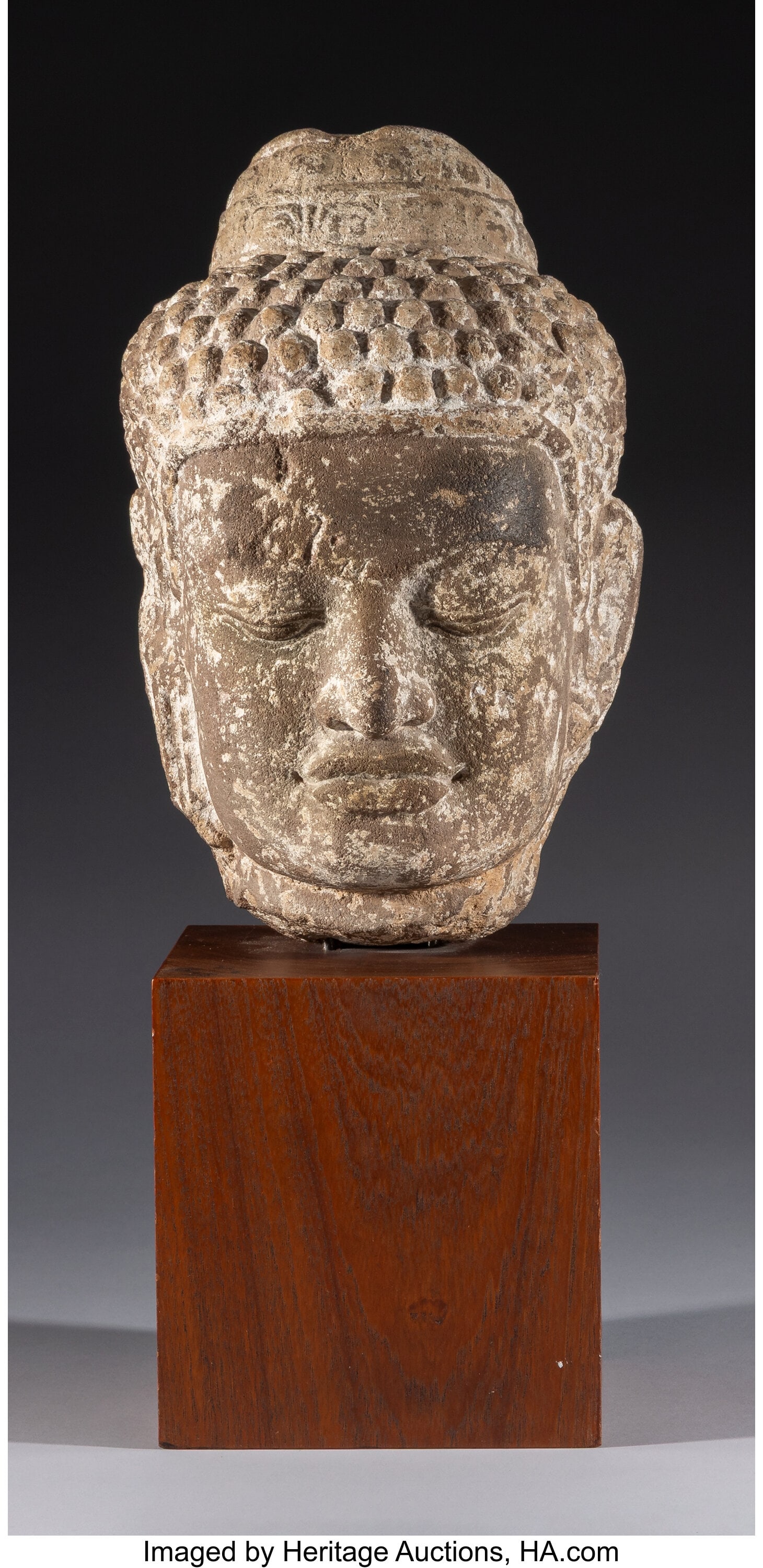 A Carved Stone Head of a Figure: Buddha 12 x 7-1 (1 of 3)