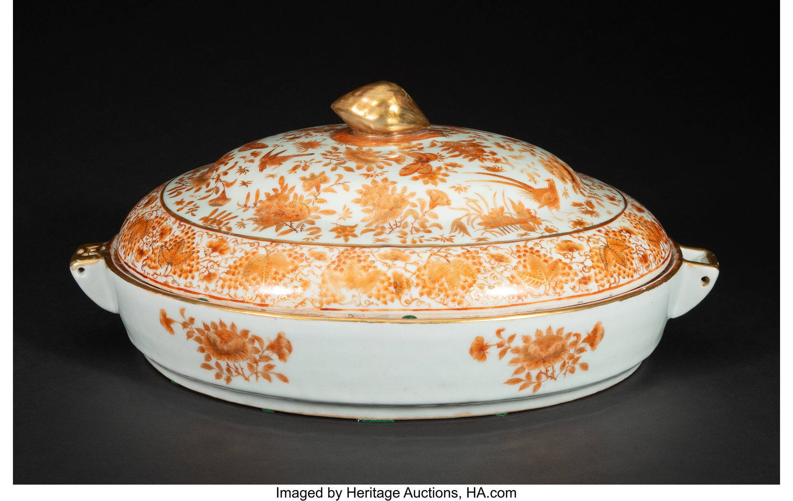 A Large Chinese Export Iron-Red Decorated and Pa: A Large Chinese Export Iron-Red Decorated and Partial Gilt Covered Warming Platter, 19th century 7 x 15-1/2 x 11-1/8 inches (17.8 x 39.4 x 28.3 cm) HID0310