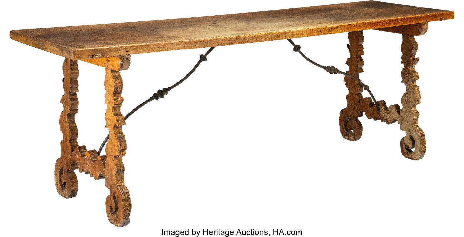 A Spanish Baroque-Style Carved Walnut and Wrough: A Spanish Baroque-Style Carved Walnut and Wrought Iron Table 32-1/2 x 89 x 24-7/8 inches (82.5 x 226.1 x 63.2 cm) Property from a Rancho Santa Fe, Californ