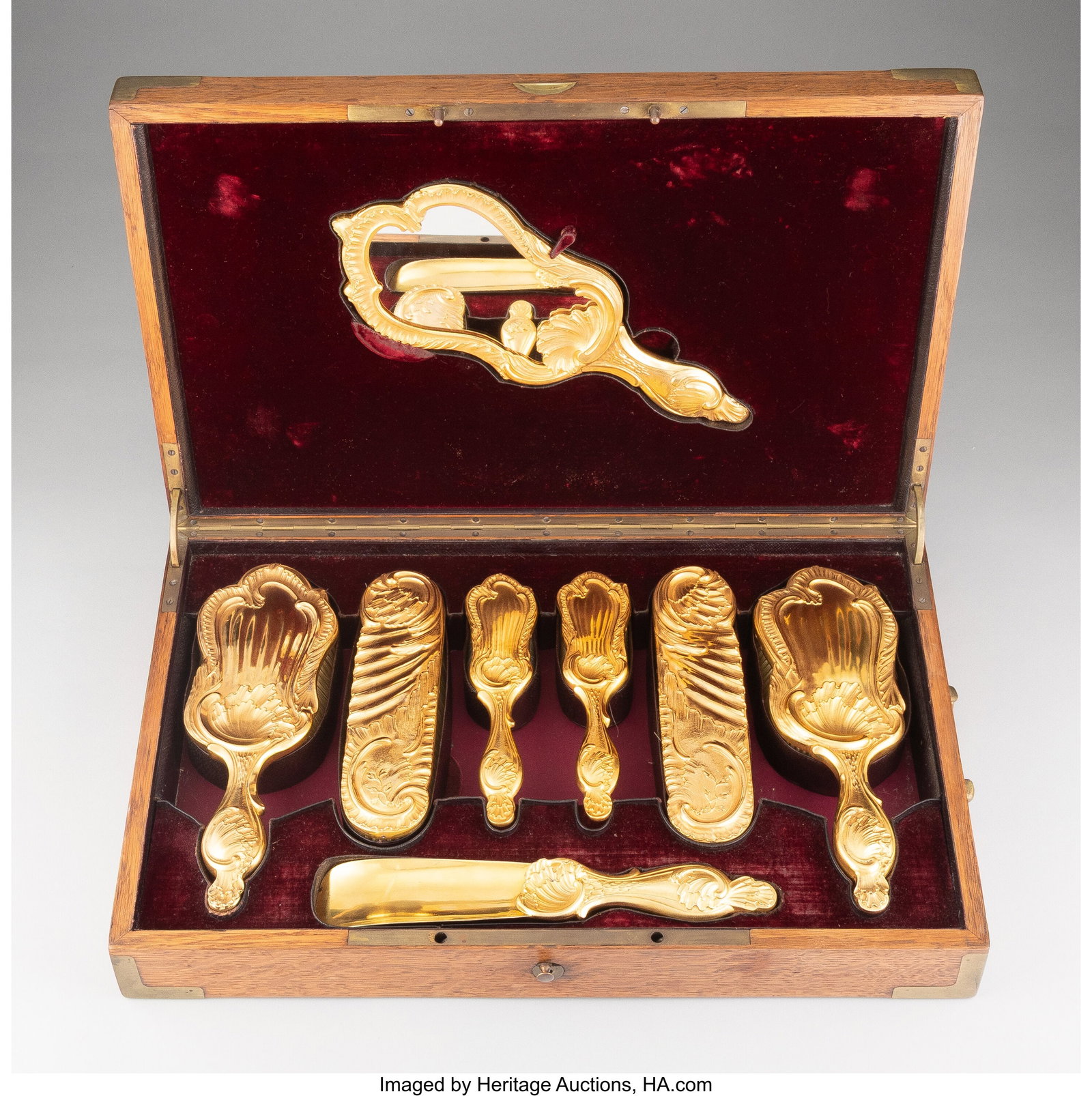 An Eight-Piece Paul Sormani Gilt Silver Cased Ne: An Eight-Piece Paul Sormani Gilt Silver Cased Necessaire de Voyage, late 19th century Marks: (Minerva), (star-S-star) 11-1/2 x 4-3/4 x 0-1/2 inches &l