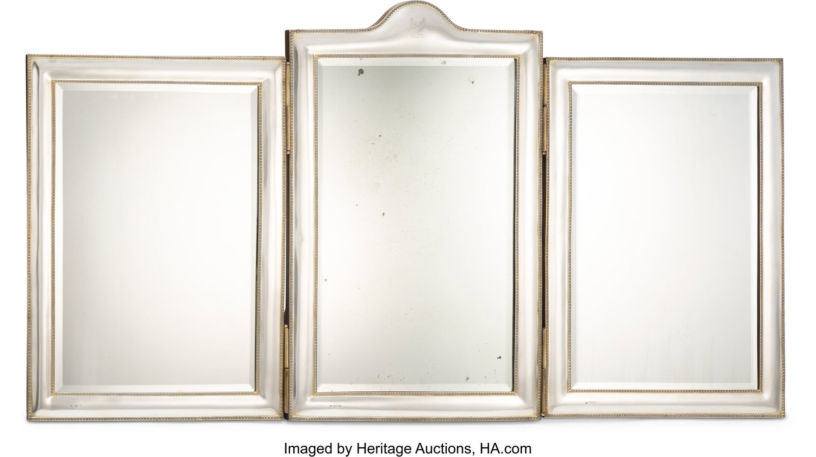 A Goldsmiths and Silversmiths Co. Ltd. Silver-Ov: A Goldsmiths and Silversmiths Co. Ltd. Silver-Overlaid Tri-Fold Easel Back Vanity Mirror, London, 1899 Marks: (lion passant), (leopard's head)