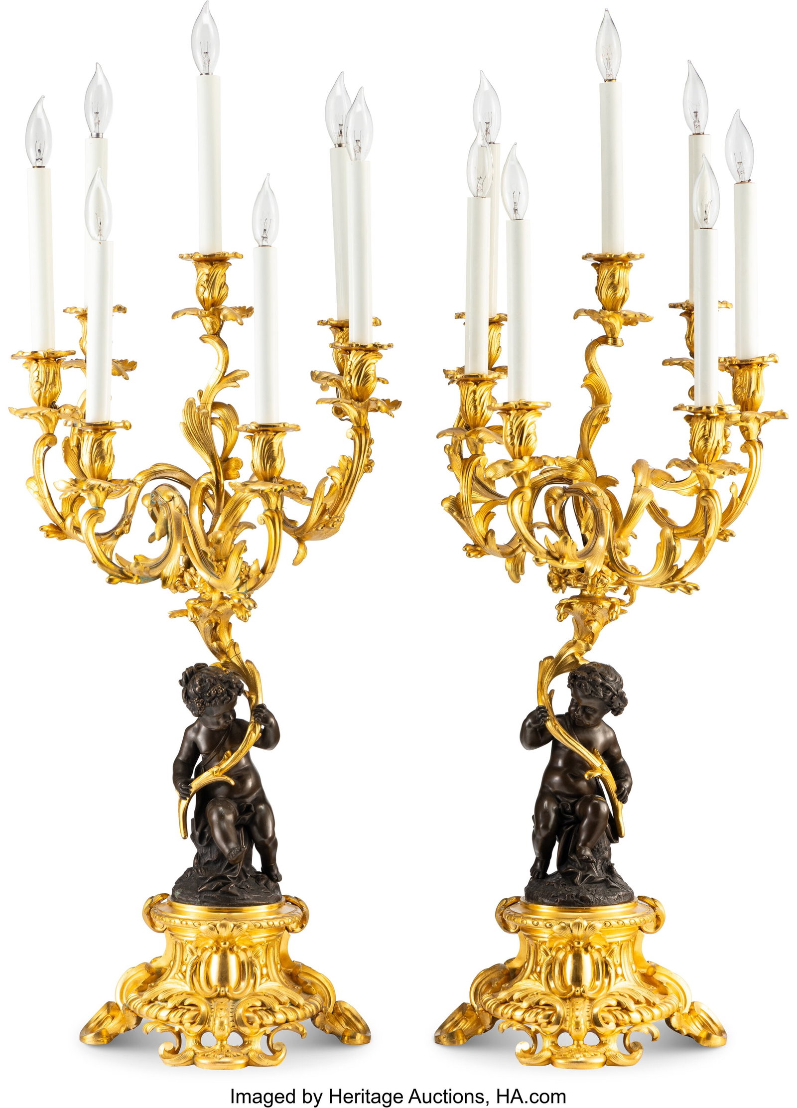 A Pair of Louis XVI-Style Partial Gilt Bronze Se: A Pair of Louis XVI-Style Partial Gilt Bronze Seven-Light Figural Candelabra After Claude Michel Clodion, circa 1870 37 x 13-3/4 x 13-3/4 inches (94.0 x 34.9 x 34&peri