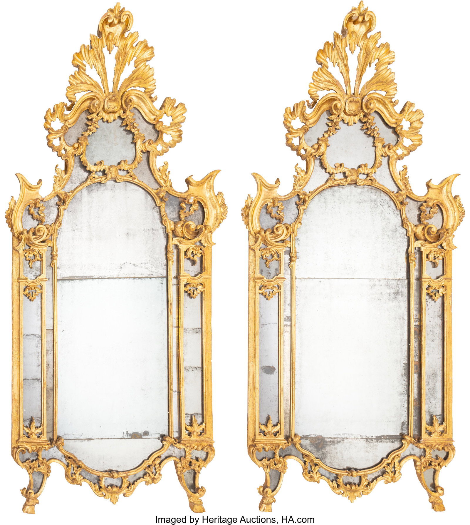 A Pair of Italian Gilt Wood Mirrors, mid-18th ce: A Pair of Italian Gilt Wood Mirrors, mid-18th century 108-1/2 x 55-1/2 x 8 inches (275.6 x 141.0 x 20.3 cm) (each) Property from a Private Collec