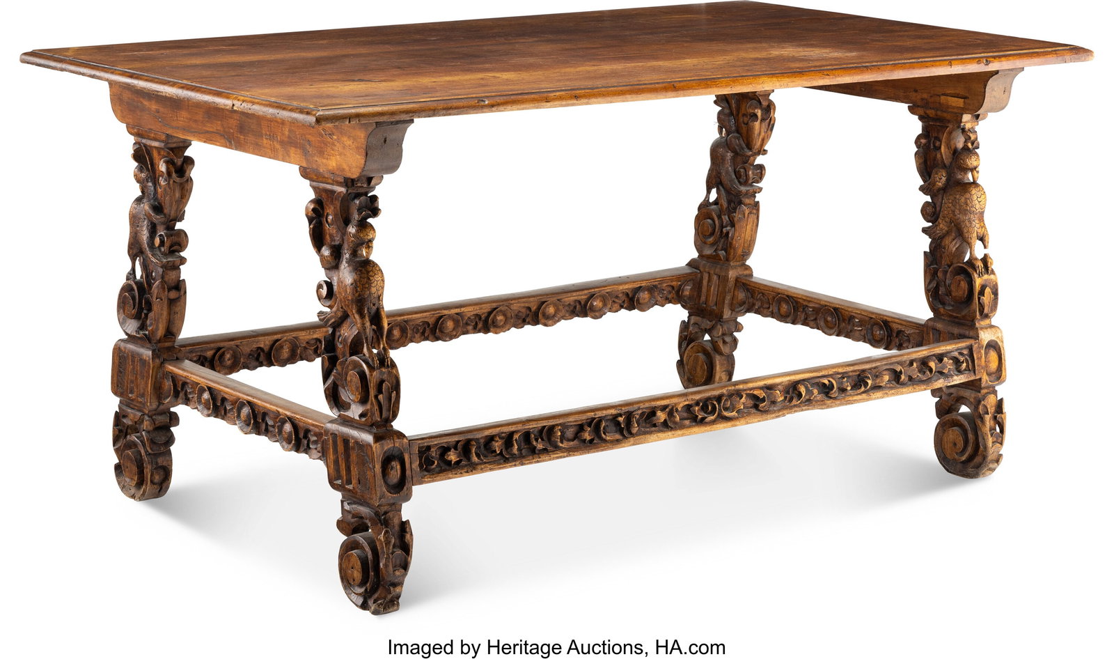 A Large Spanish Baroque Carved Walnut Center Tab: A Large Spanish Baroque Carved Walnut Center Table, 18th century 34-3/4 x 71-1/2 x 41-1/2 inches (88.3 x 181.6 x 105.4 cm) Property from a Rancho Santa