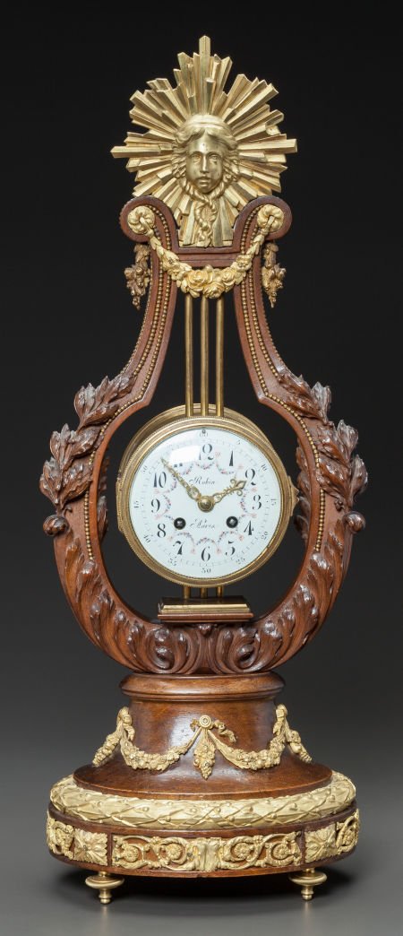 A FRENCH ESCALIER DE CRISTAL CARVED WOOD AND GIL: A FRENCH ESCALIER DE CRISTAL CARVED WOOD AND GILT BRONZE MOUNTED LYRE-FORM CLOCK19th centu