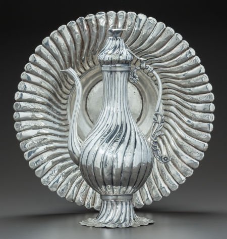 AN ISLAMIC-STYLE SILVERED BRASS EWER AND BASIN C: AN ISLAMIC-STYLE SILVERED BRASS EWER AND BASIN Circa 1900 13-3/4 inches high (34.9 cm) (