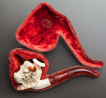 A MEERSCHAUM PIPE OF A BUFFALO WITH ORIGINAL CAS: A MEERSCHAUM PIPE OF A BUFFALO WITH ORIGINAL CASELate 19th century9 inches long (22.9