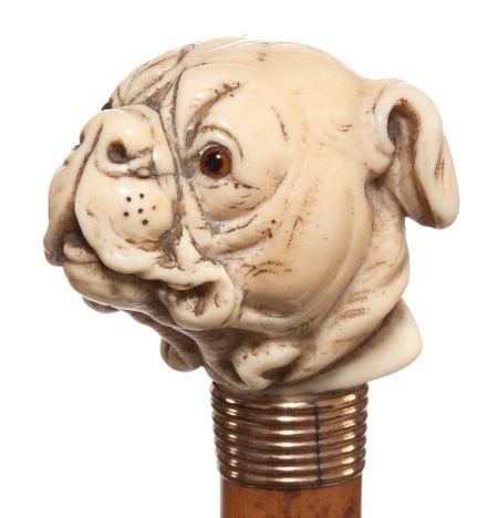 A CARVED IVORY AND WOOD DOG CANE Circa 1900 35-: A CARVED IVORY AND WOOD DOG CANE Circa 1900 35-1/2 inches length overall (90.2 cm)