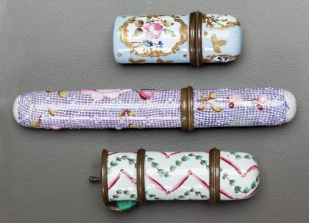 TWO ENAMELED METAL CASED PERFUME VILES AND AN EN: TWO ENAMELED METAL CASED PERFUME VILES AND AN ENAMELED METAL NEEDLE CASE19th century4-