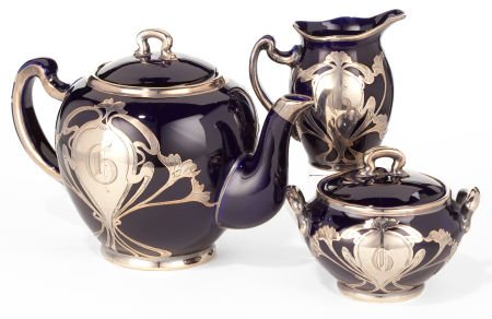 A THREE-PIECE LENOX PORCELAIN SILVER OVERLAY TEA: A THREE-PIECE LENOX PORCELAIN SILVER OVERLAY TEA SET Circa 1900Marks: (L within l