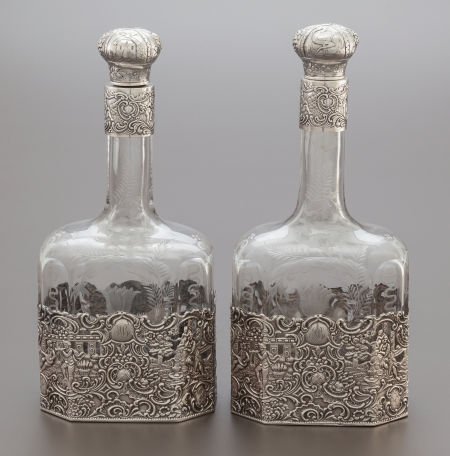 A PAIR OF MAUSER SILVER OVERLAY ETCHED GLASS DEC: A PAIR OF MAUSER SILVER OVERLAY ETCHED GLASS DECANTERS The Mauser Manufacturing Company, Ne
