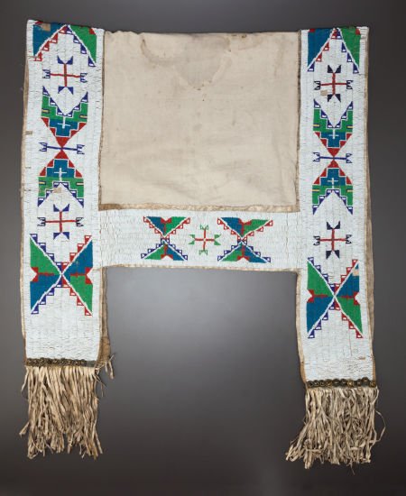 A SIOUX BEADED HIDE SADDLE BLANKET c. 1900: A SIOUX BEADED HIDE SADDLE BLANKETc. 1900 sinew sewn and lane-stitched in blue, yellow,