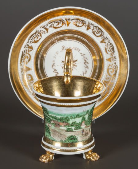 A BERLIN PORCELAIN TOPOGRAPHICAL CUP AND SAUCER : A BERLIN PORCELAIN TOPOGRAPHICAL CUP AND SAUCER Berlin, Germany, circa 1820 Marks: